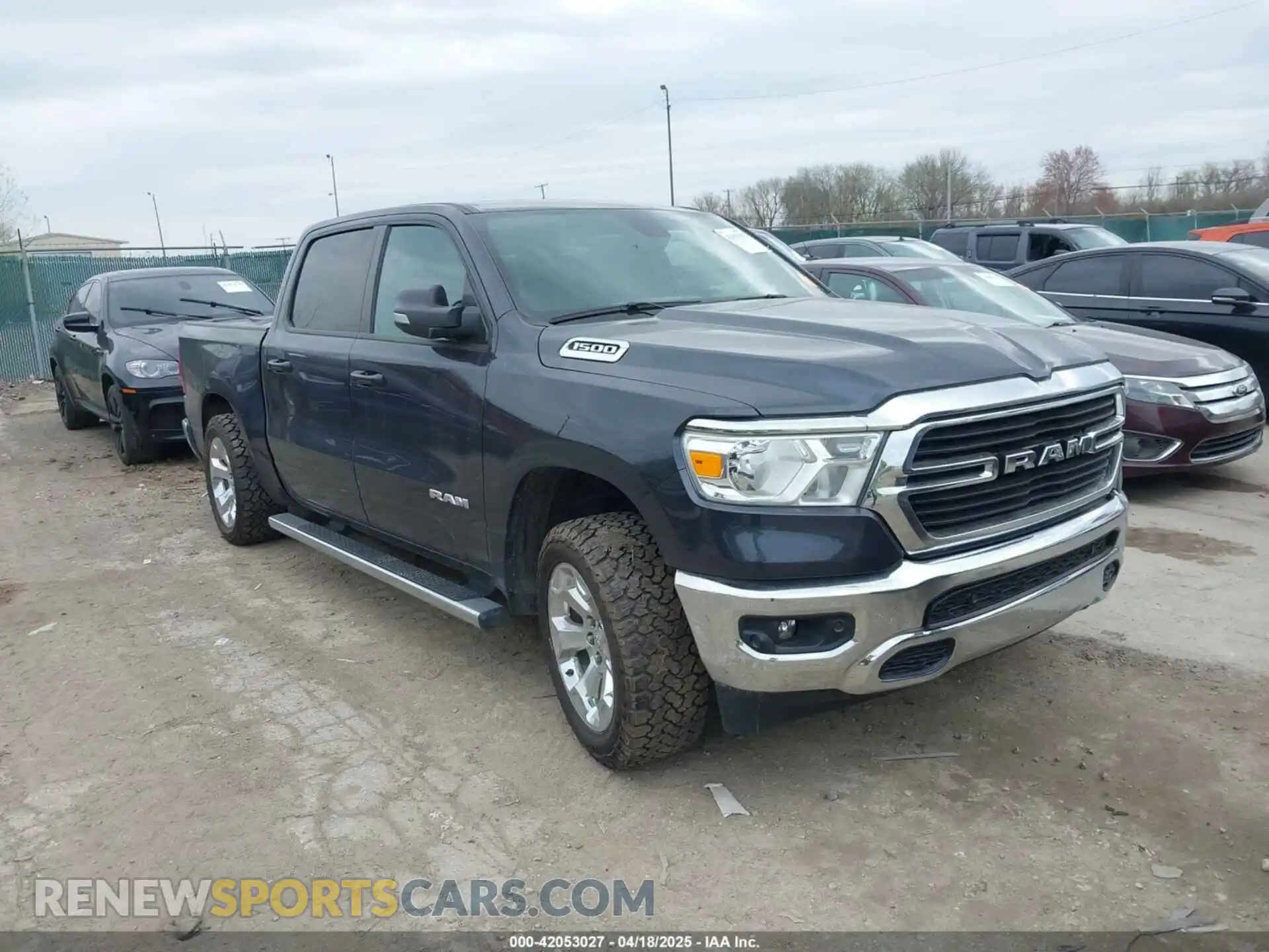 1 Photograph of a damaged car 1C6RRFFG7MN521057 RAM 1500 2021