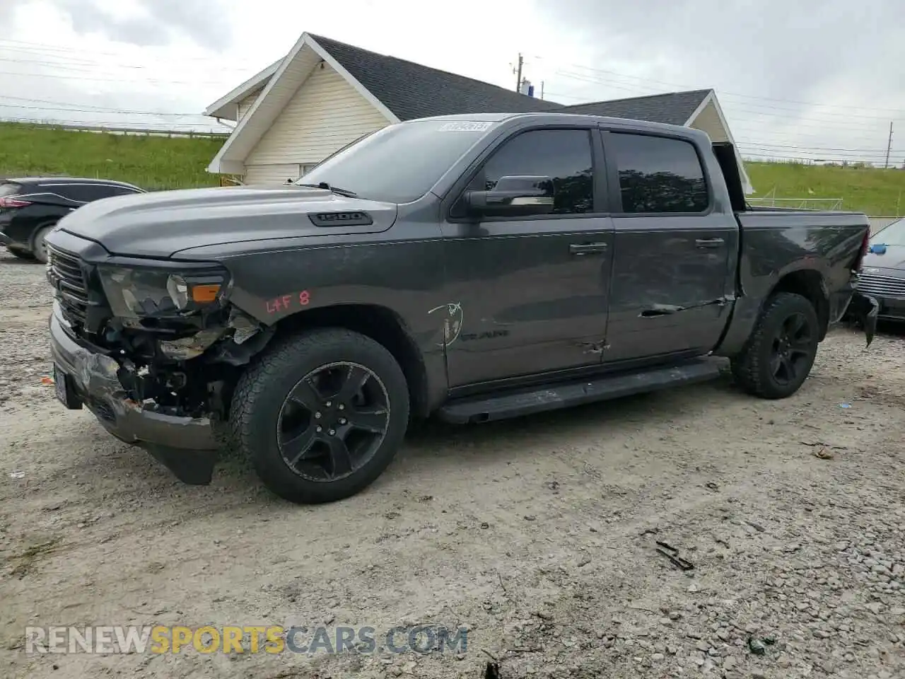 1 Photograph of a damaged car 1C6RRFFGXMN590468 RAM 1500 2021