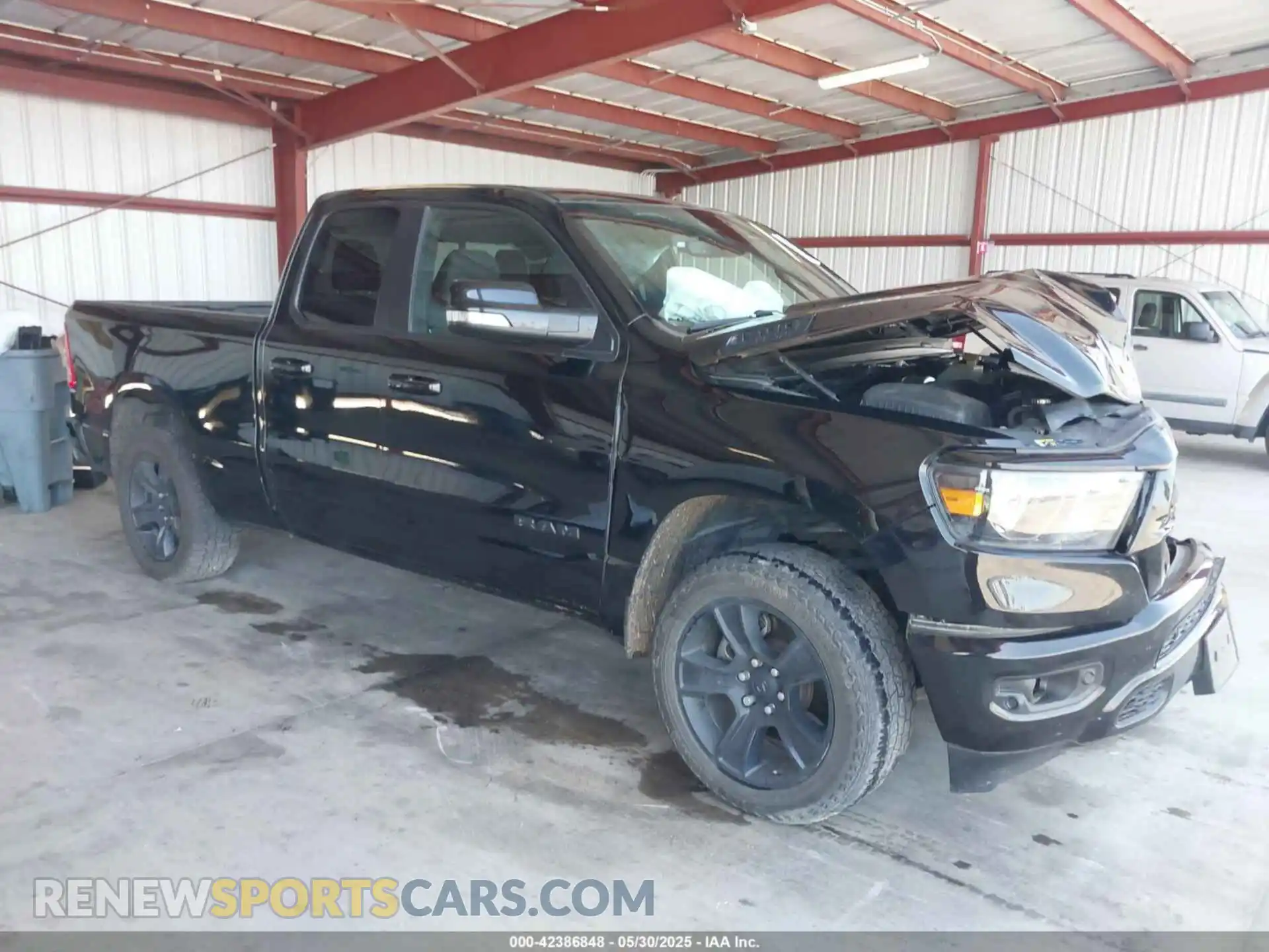 1 Photograph of a damaged car 1C6SRFBT2MN562927 RAM 1500 2021