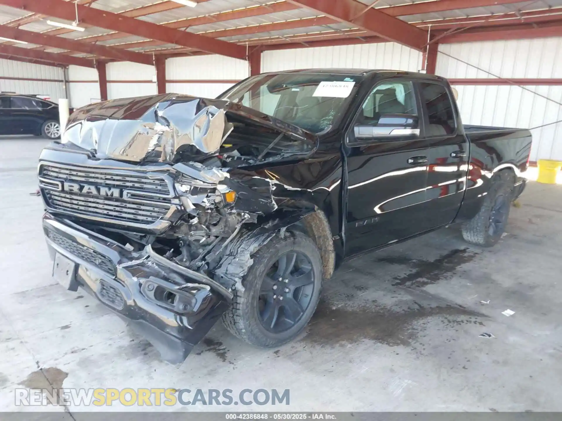 2 Photograph of a damaged car 1C6SRFBT2MN562927 RAM 1500 2021