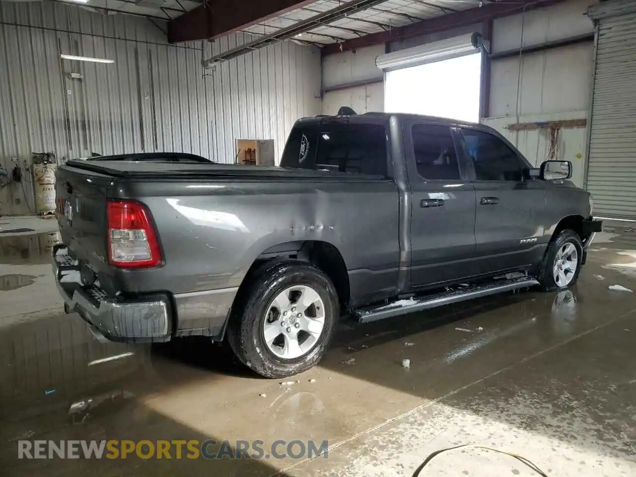 3 Photograph of a damaged car 1C6SRFBTXMN572525 RAM 1500 2021