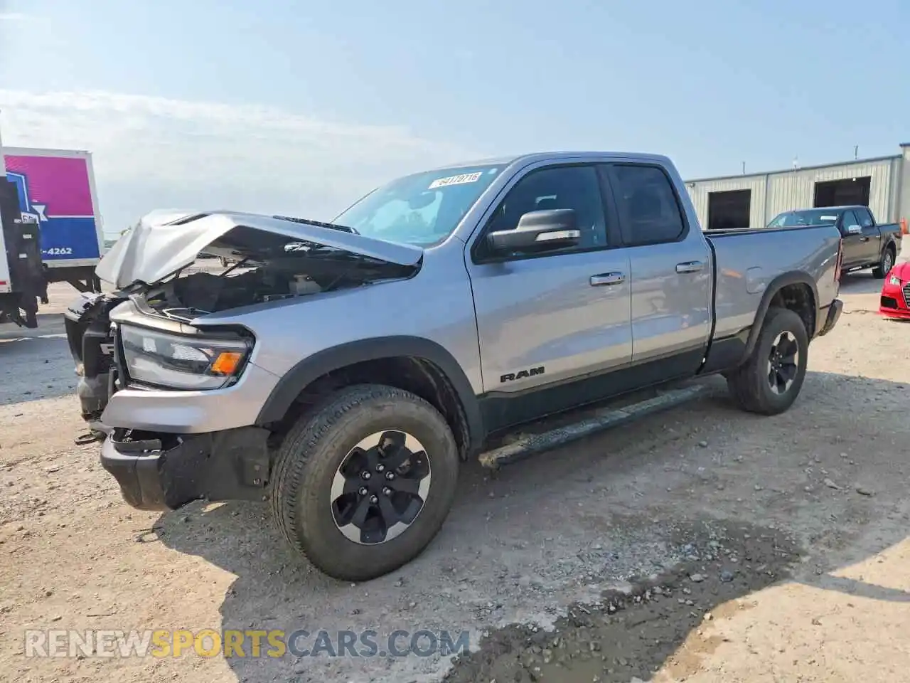 1 Photograph of a damaged car 1C6SRFET7MN541955 RAM 1500 2021