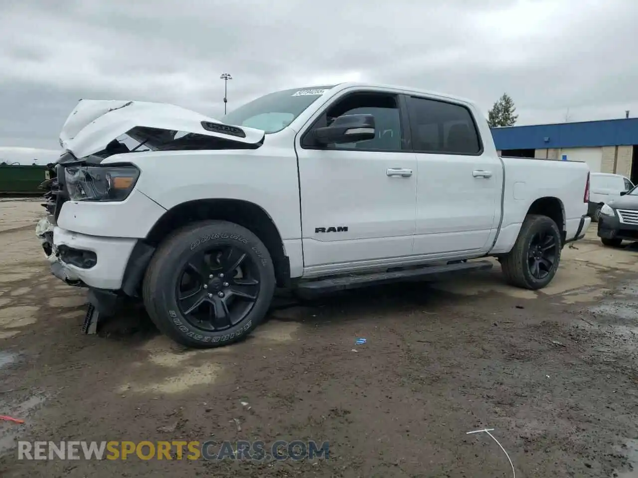 1 Photograph of a damaged car 1C6SRFFT0MN508939 RAM 1500 2021