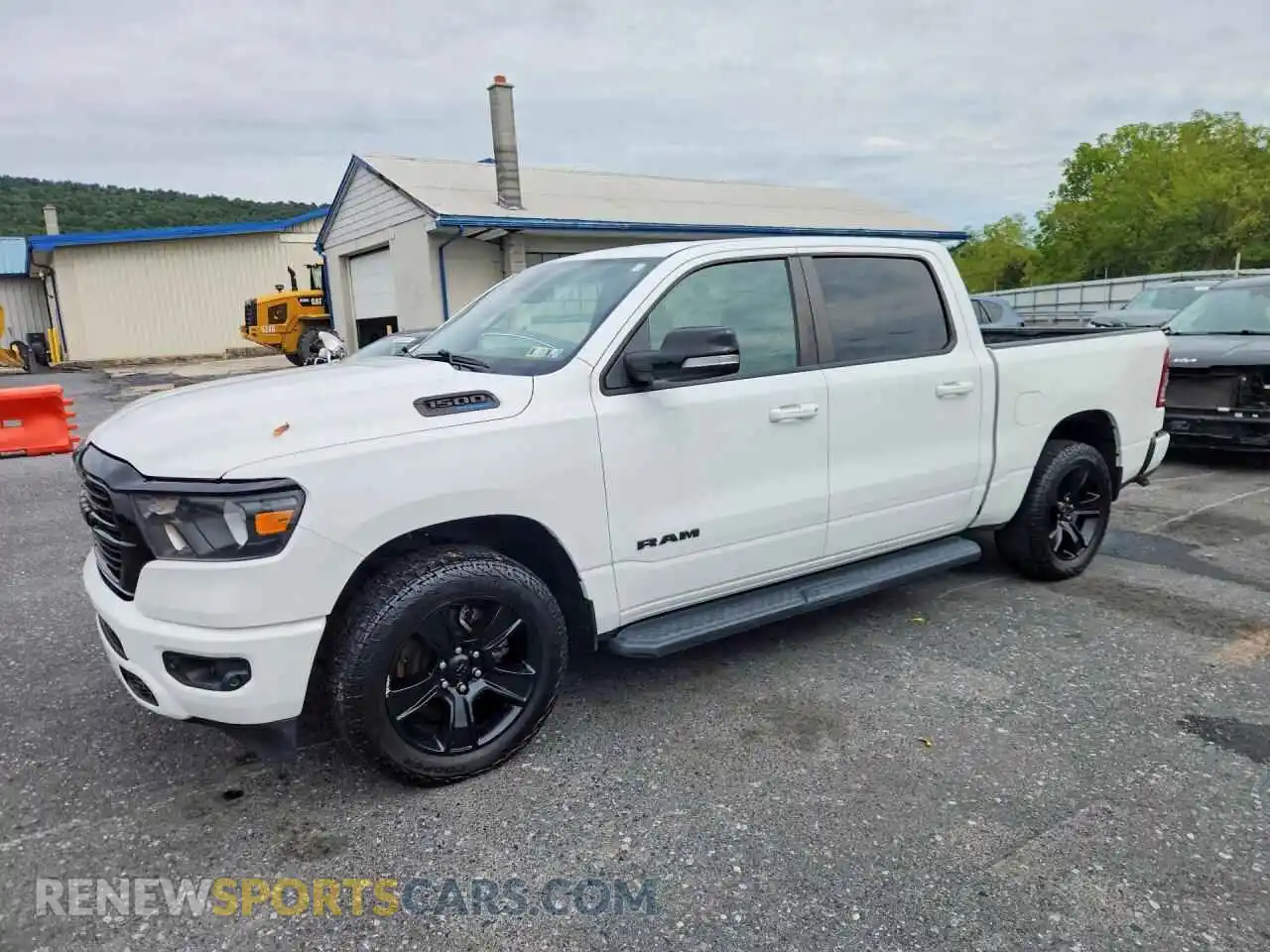 1 Photograph of a damaged car 1C6SRFFT0MN509413 RAM 1500 2021