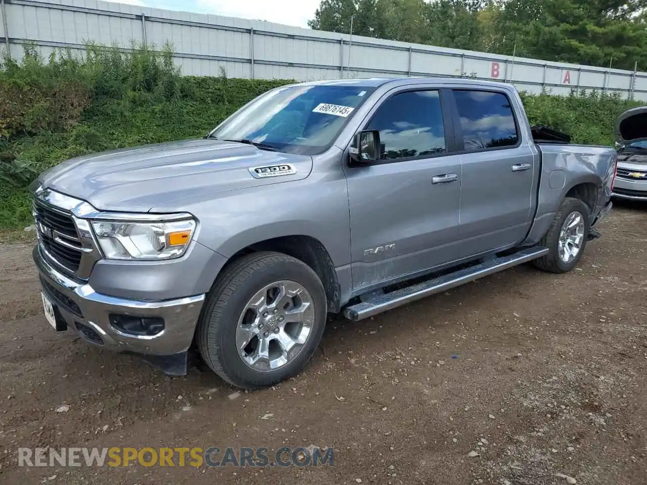 1 Photograph of a damaged car 1C6SRFFT0MN535364 RAM 1500 2021