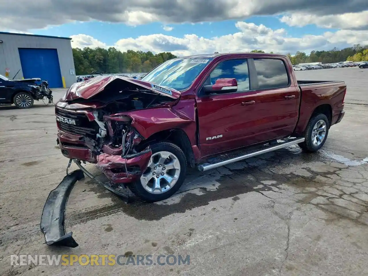 1 Photograph of a damaged car 1C6SRFFT0MN813941 RAM 1500 2021