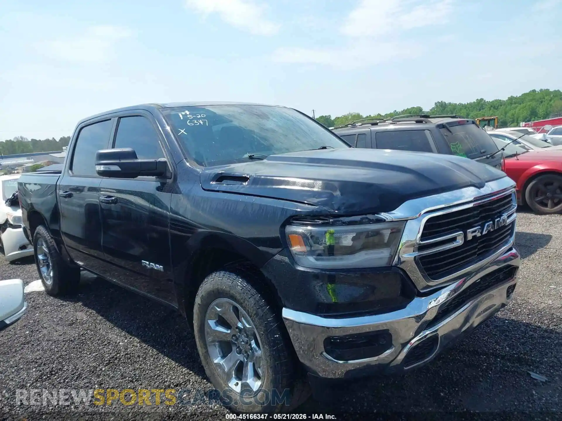1 Photograph of a damaged car 1C6SRFFT1MN646327 RAM 1500 2021