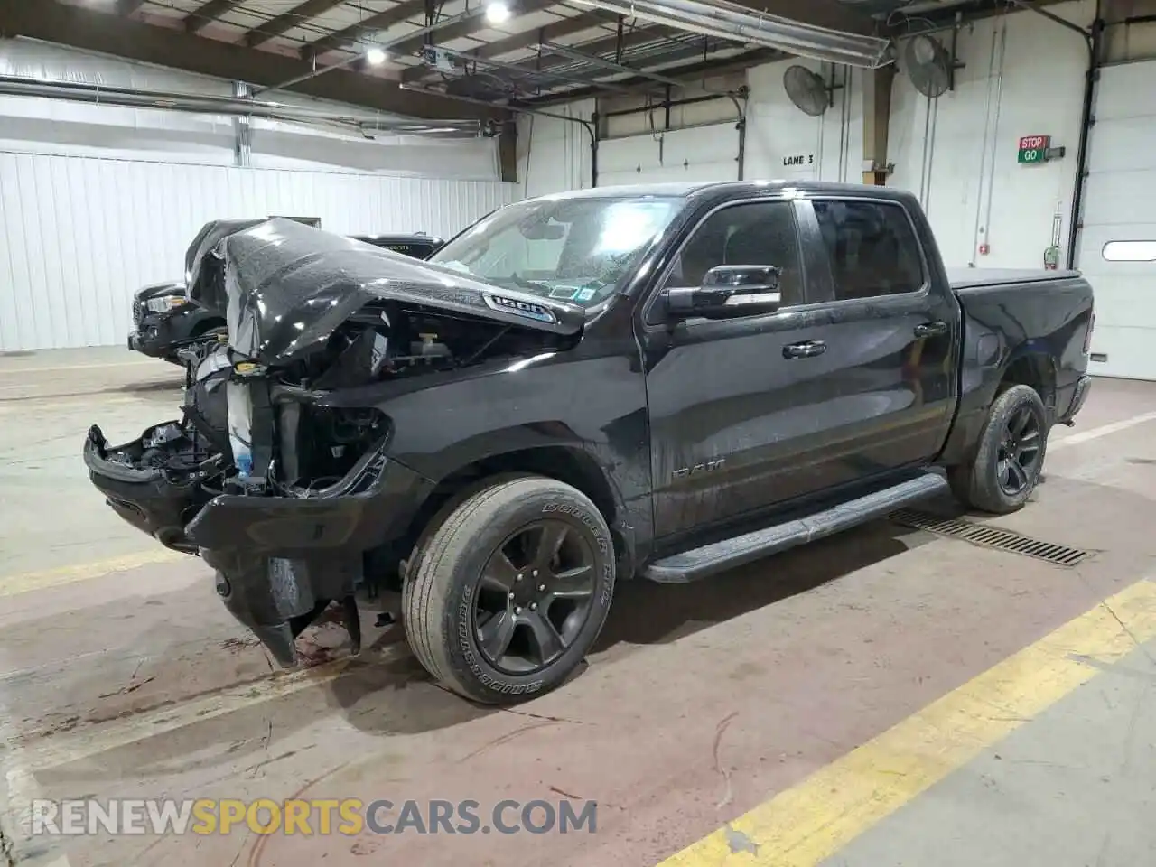 1 Photograph of a damaged car 1C6SRFFT2MN588213 RAM 1500 2021
