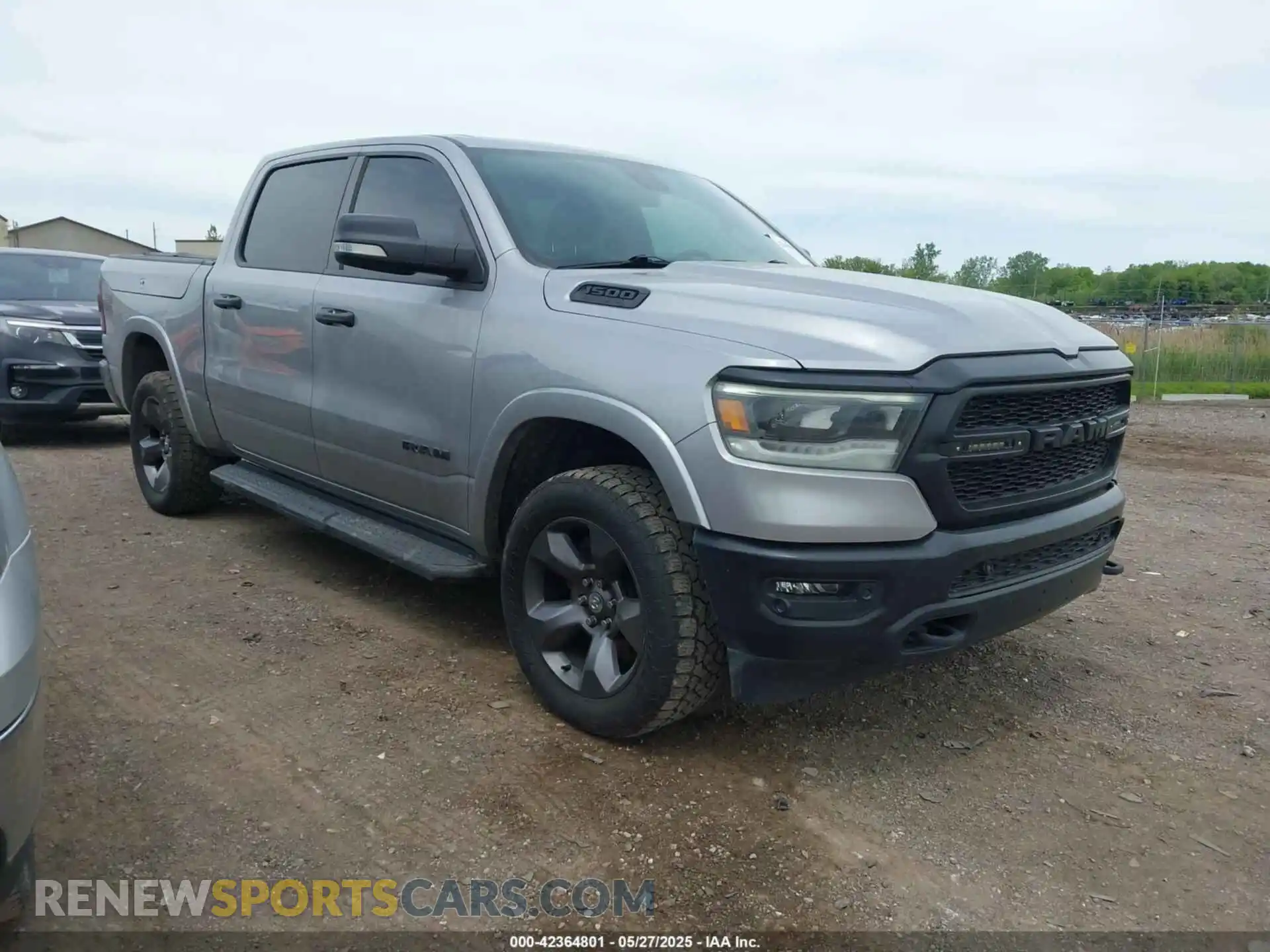 1 Photograph of a damaged car 1C6SRFFT2MN597123 RAM 1500 2021