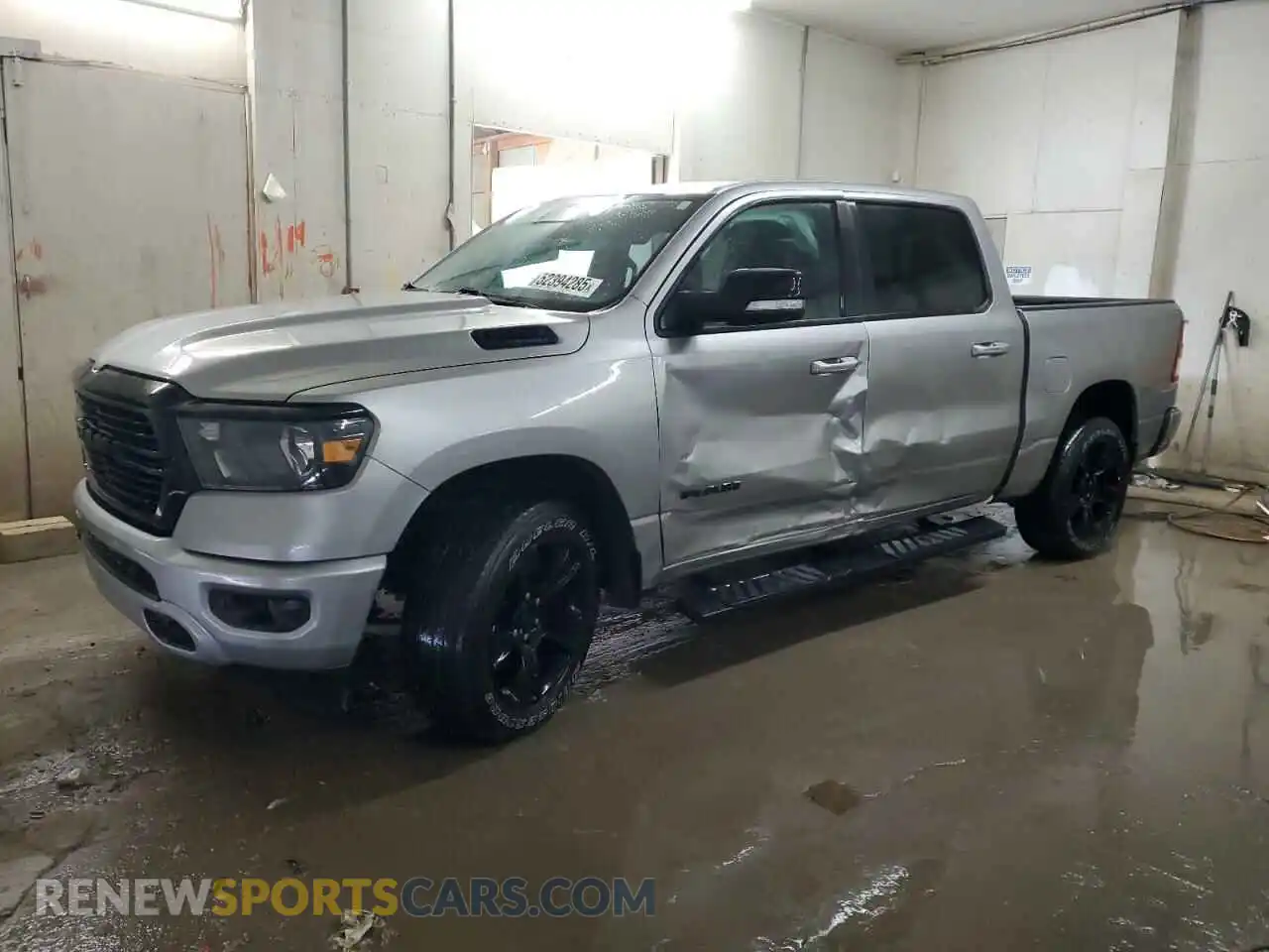 1 Photograph of a damaged car 1C6SRFFT2MN598580 RAM 1500 2021