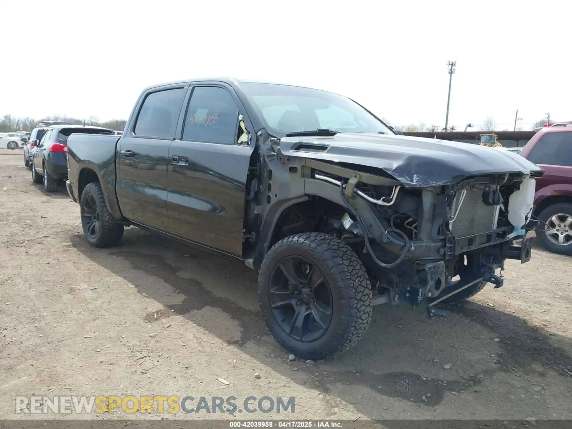 1 Photograph of a damaged car 1C6SRFFT2MN601851 RAM 1500 2021