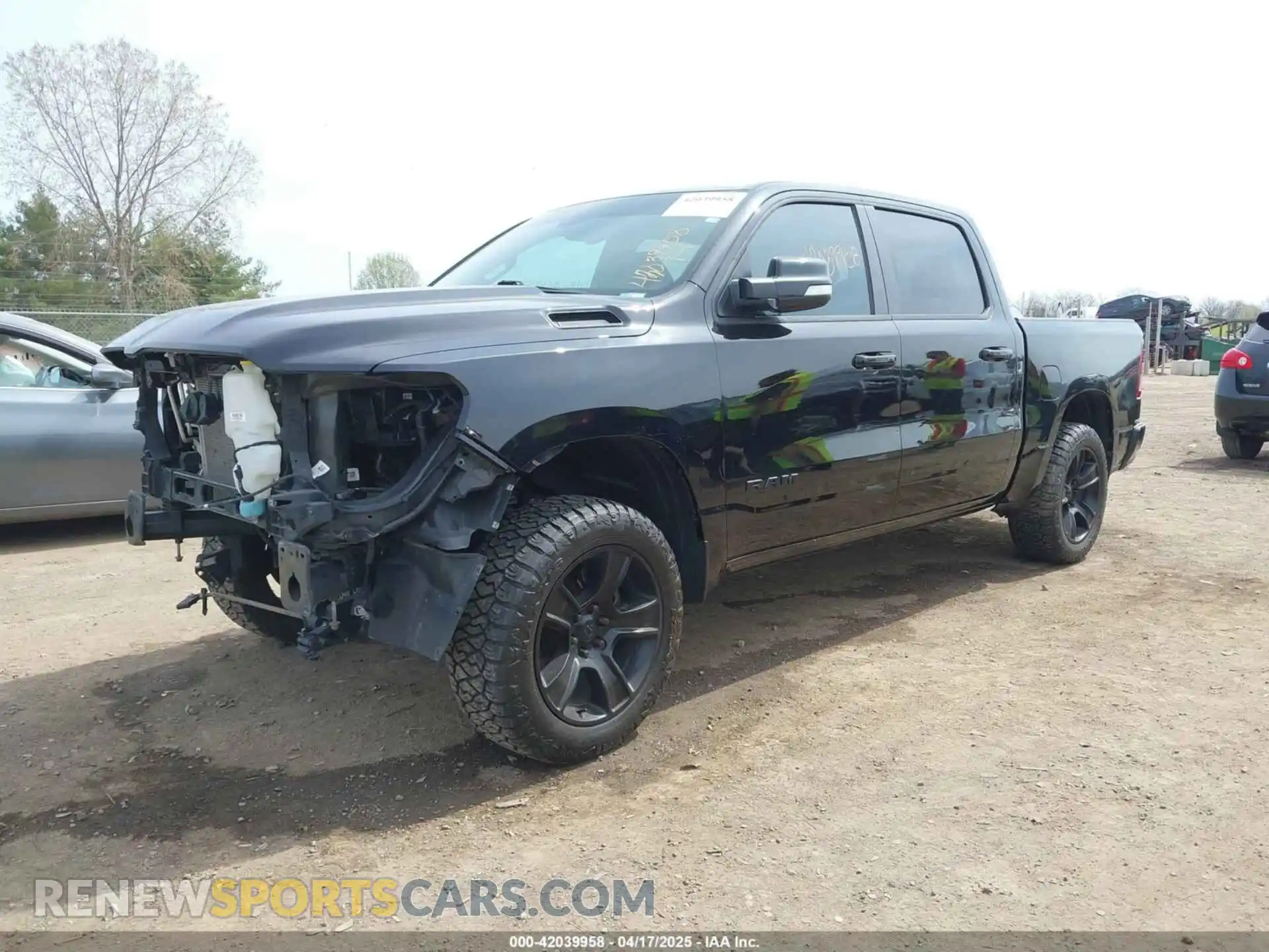 2 Photograph of a damaged car 1C6SRFFT2MN601851 RAM 1500 2021
