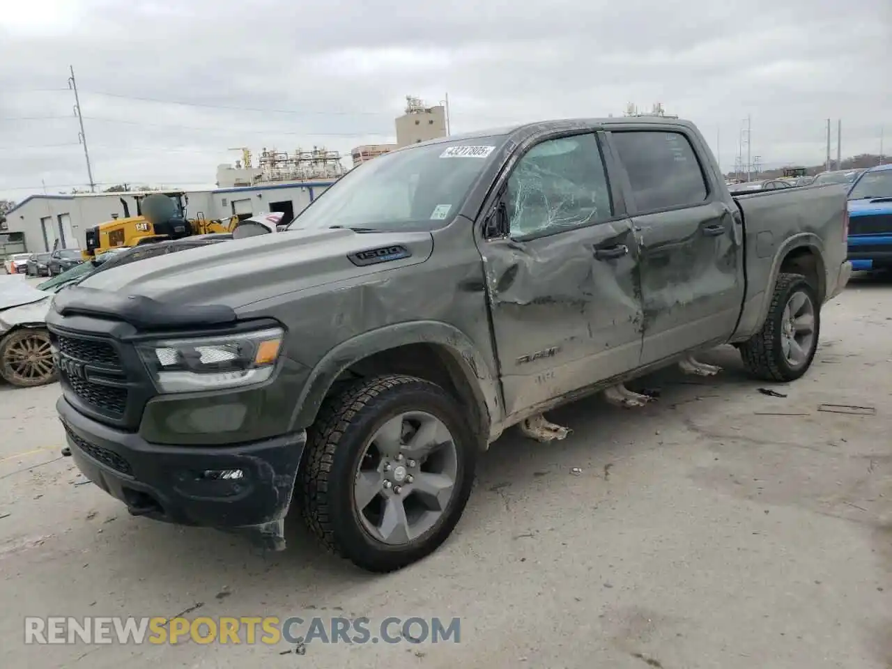 1 Photograph of a damaged car 1C6SRFFT2MN628290 RAM 1500 2021