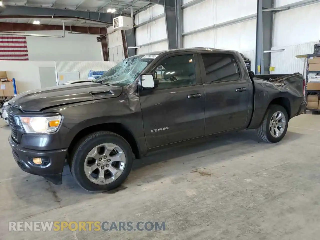1 Photograph of a damaged car 1C6SRFFT2MN634011 RAM 1500 2021