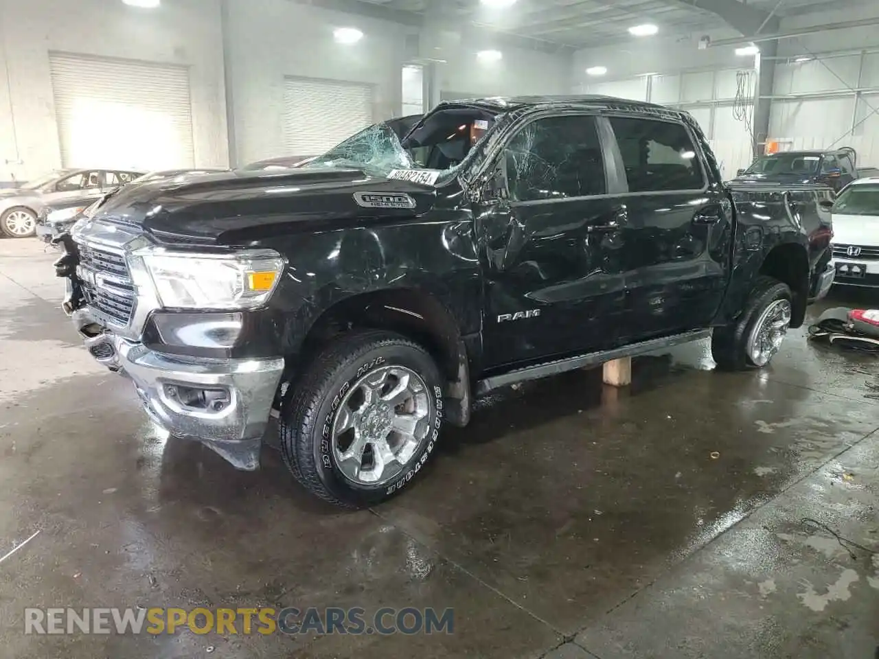 1 Photograph of a damaged car 1C6SRFFT3MN553888 RAM 1500 2021