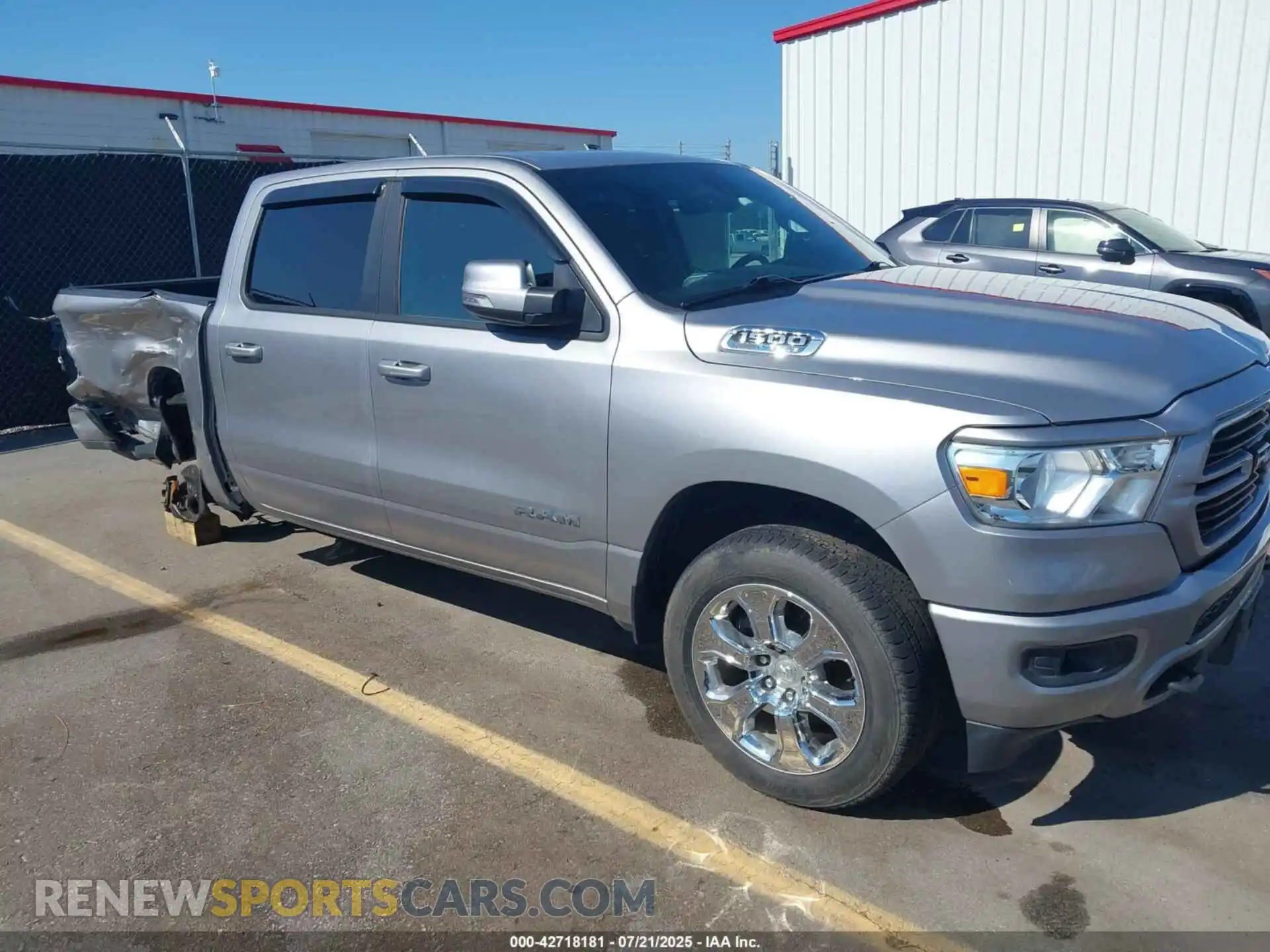 1 Photograph of a damaged car 1C6SRFFT3MN559240 RAM 1500 2021