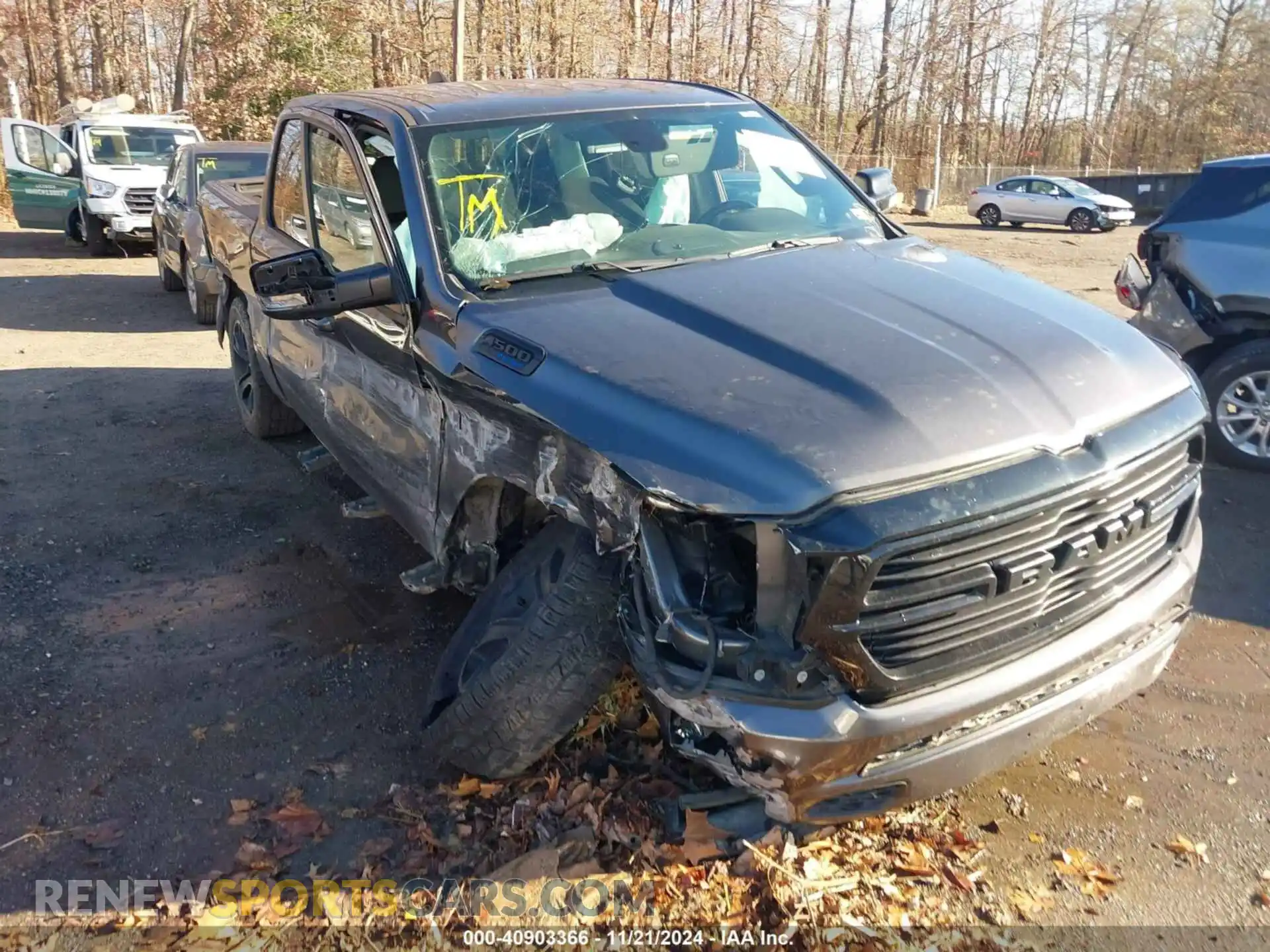 1 Photograph of a damaged car 1C6SRFFT3MN576023 RAM 1500 2021