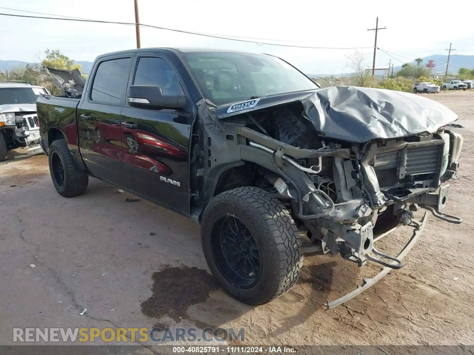 1 Photograph of a damaged car 1C6SRFFT3MN634423 RAM 1500 2021