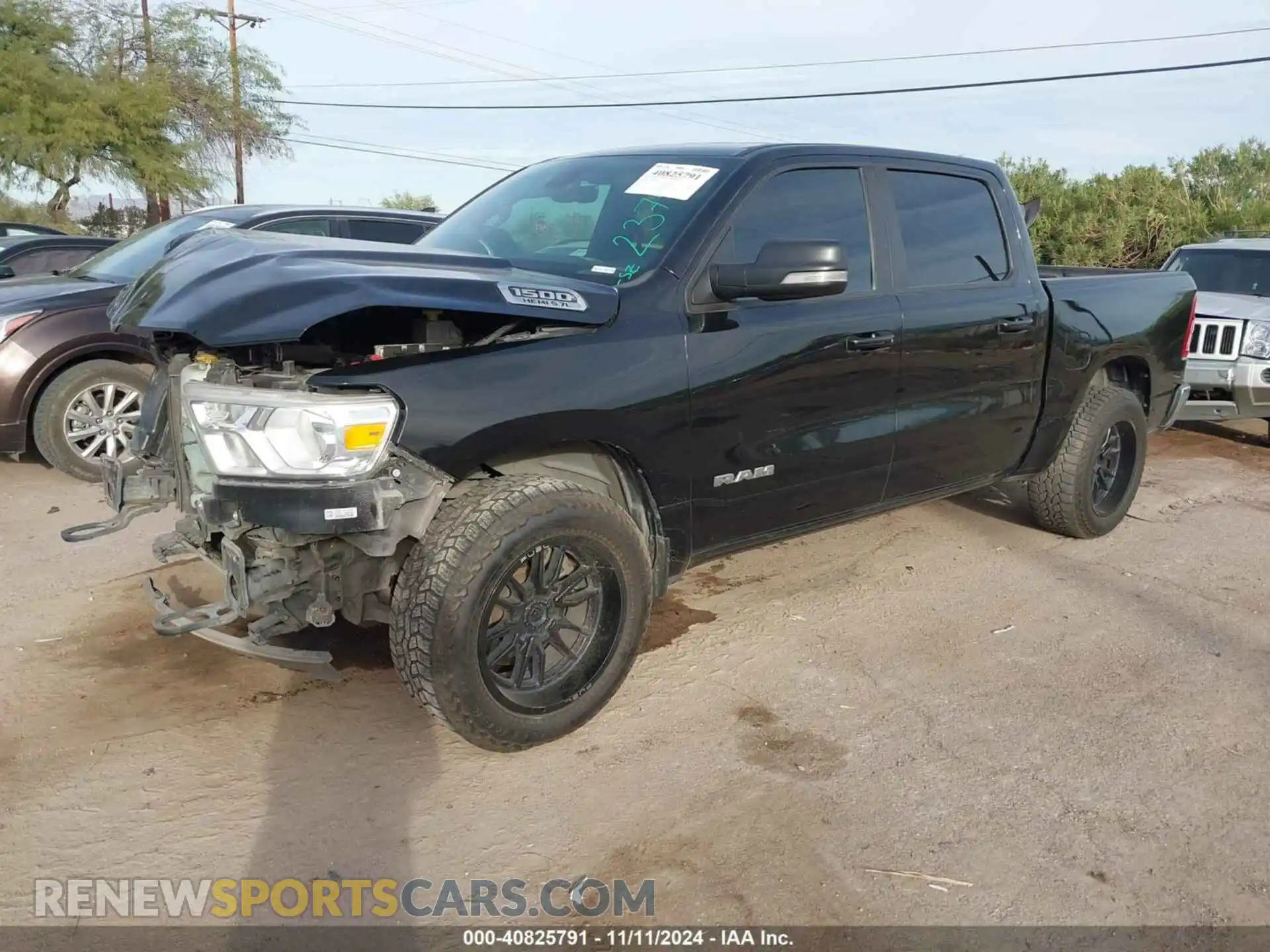 2 Photograph of a damaged car 1C6SRFFT3MN634423 RAM 1500 2021