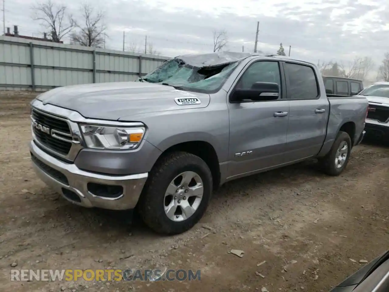 1 Photograph of a damaged car 1C6SRFFT3MN701635 RAM 1500 2021