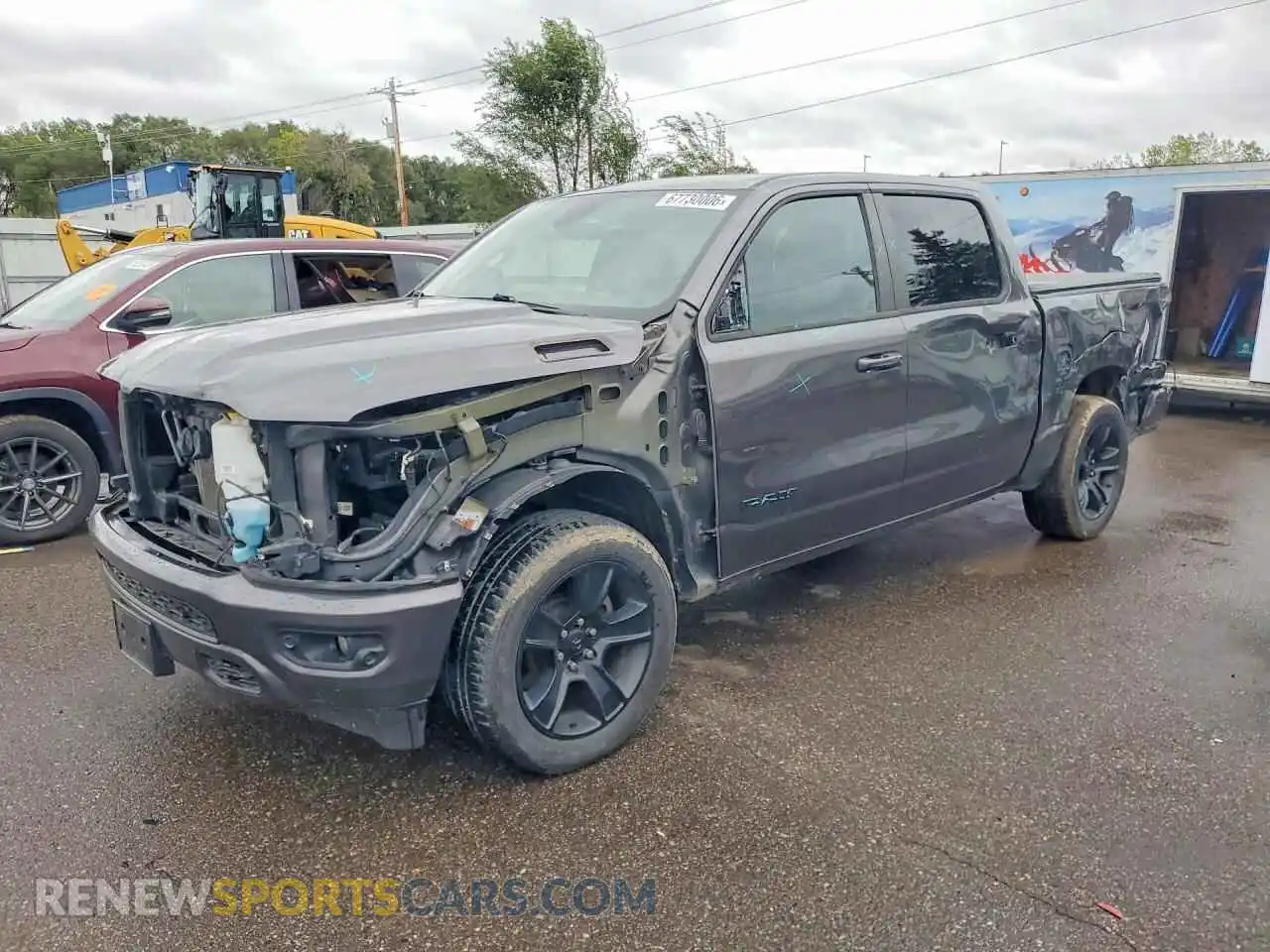 1 Photograph of a damaged car 1C6SRFFT3MN717043 RAM 1500 2021
