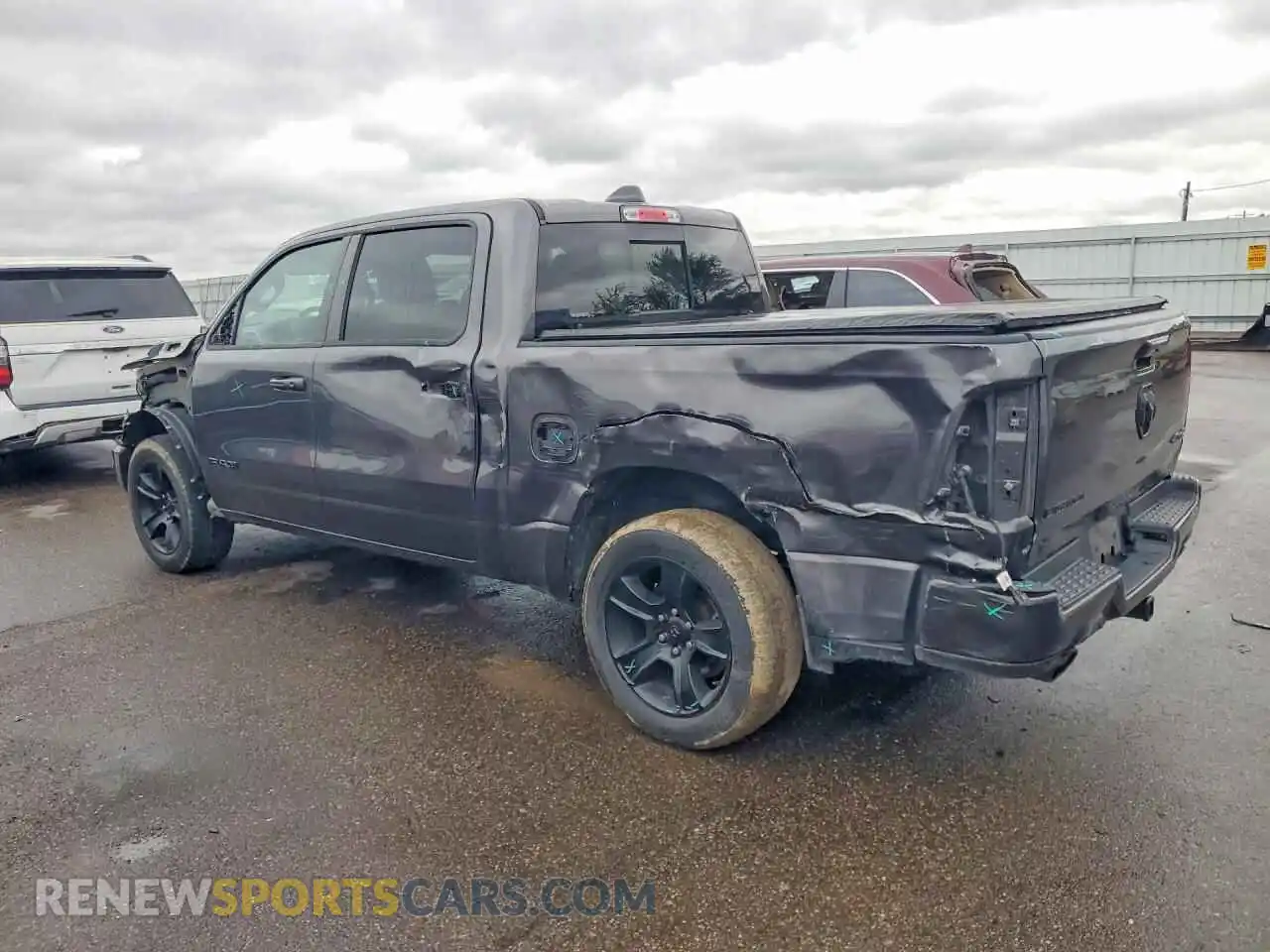 2 Photograph of a damaged car 1C6SRFFT3MN717043 RAM 1500 2021