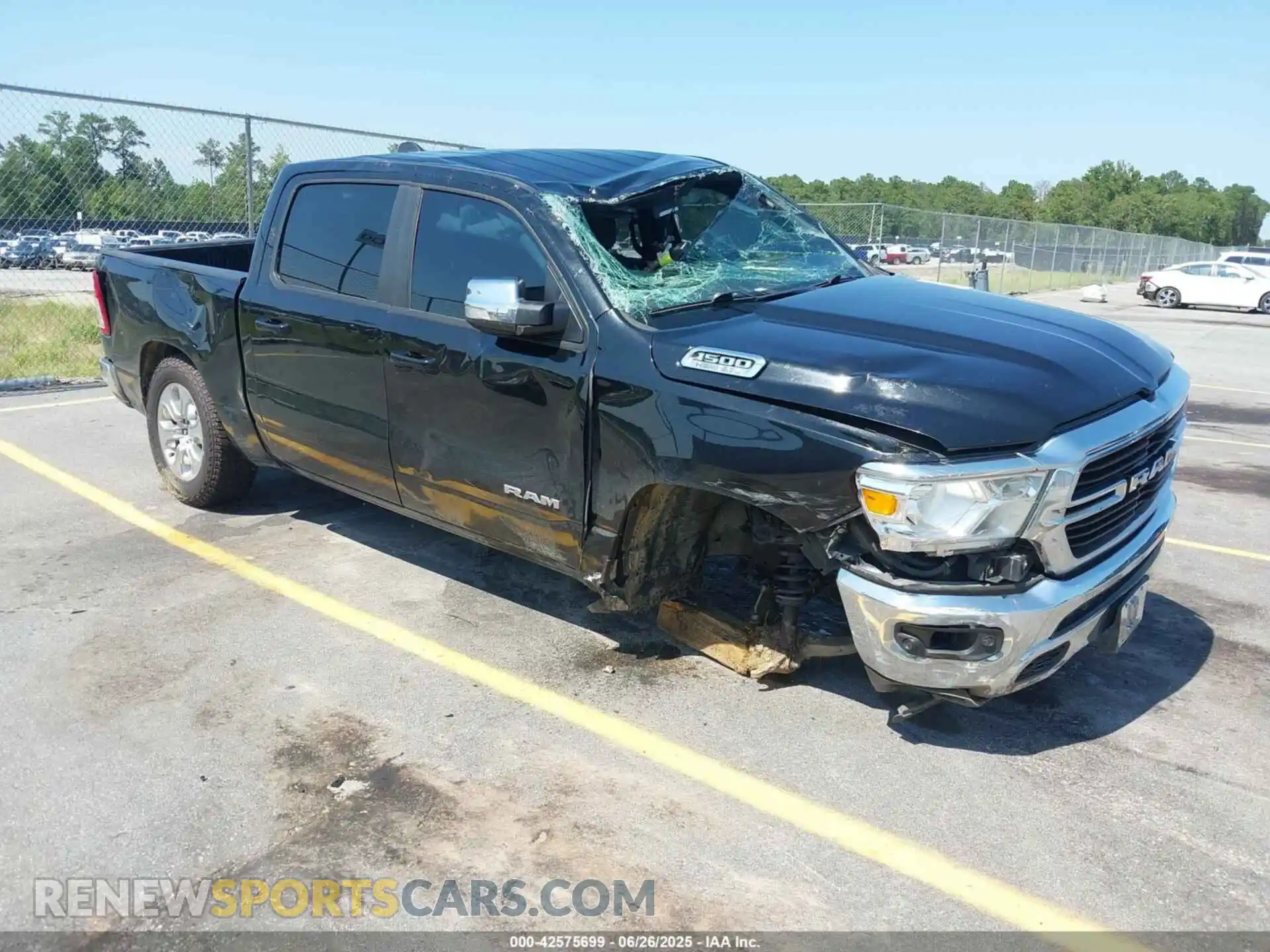 1 Photograph of a damaged car 1C6SRFFT5MN569297 RAM 1500 2021