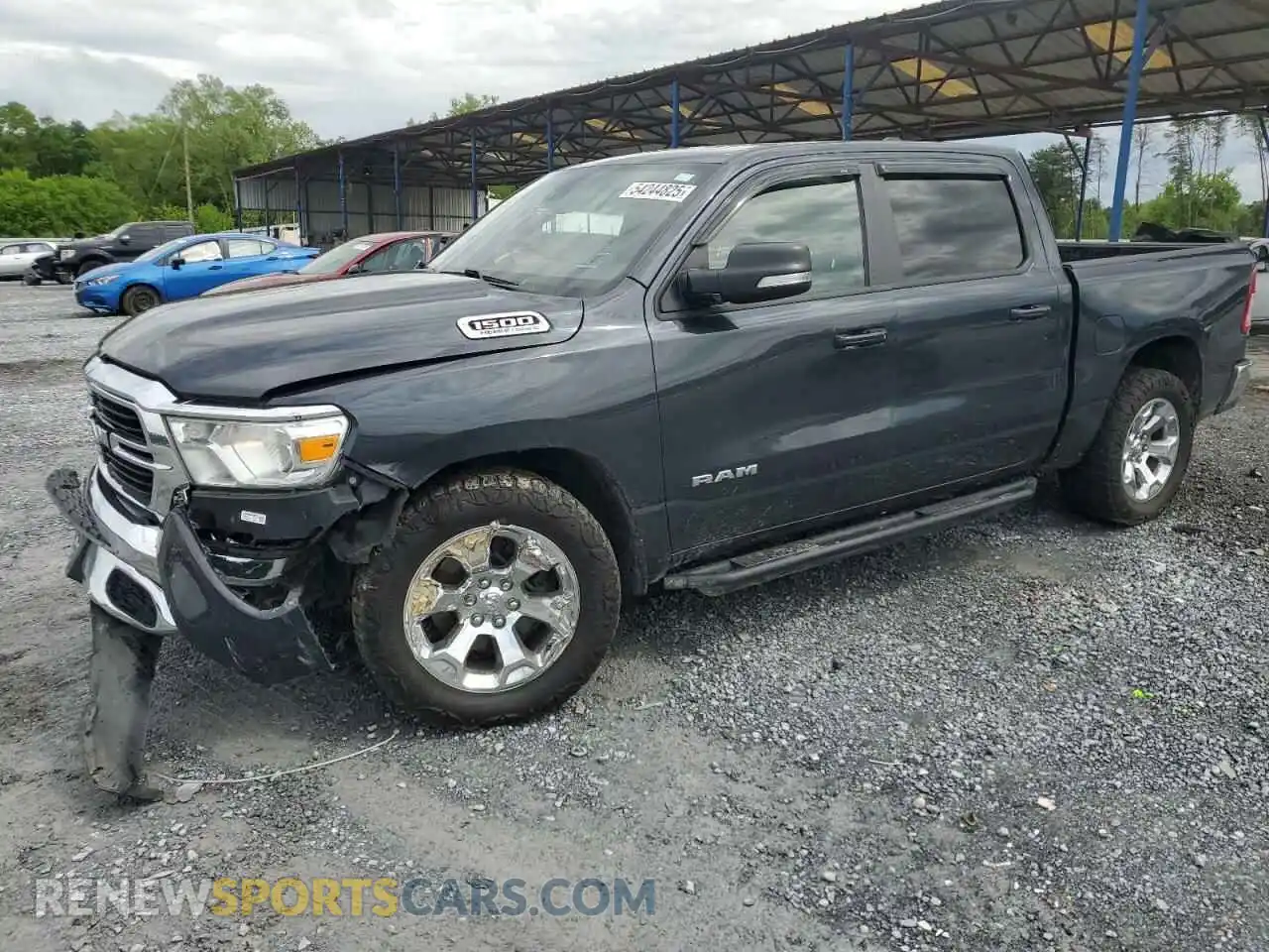 1 Photograph of a damaged car 1C6SRFFT5MN695160 RAM 1500 2021