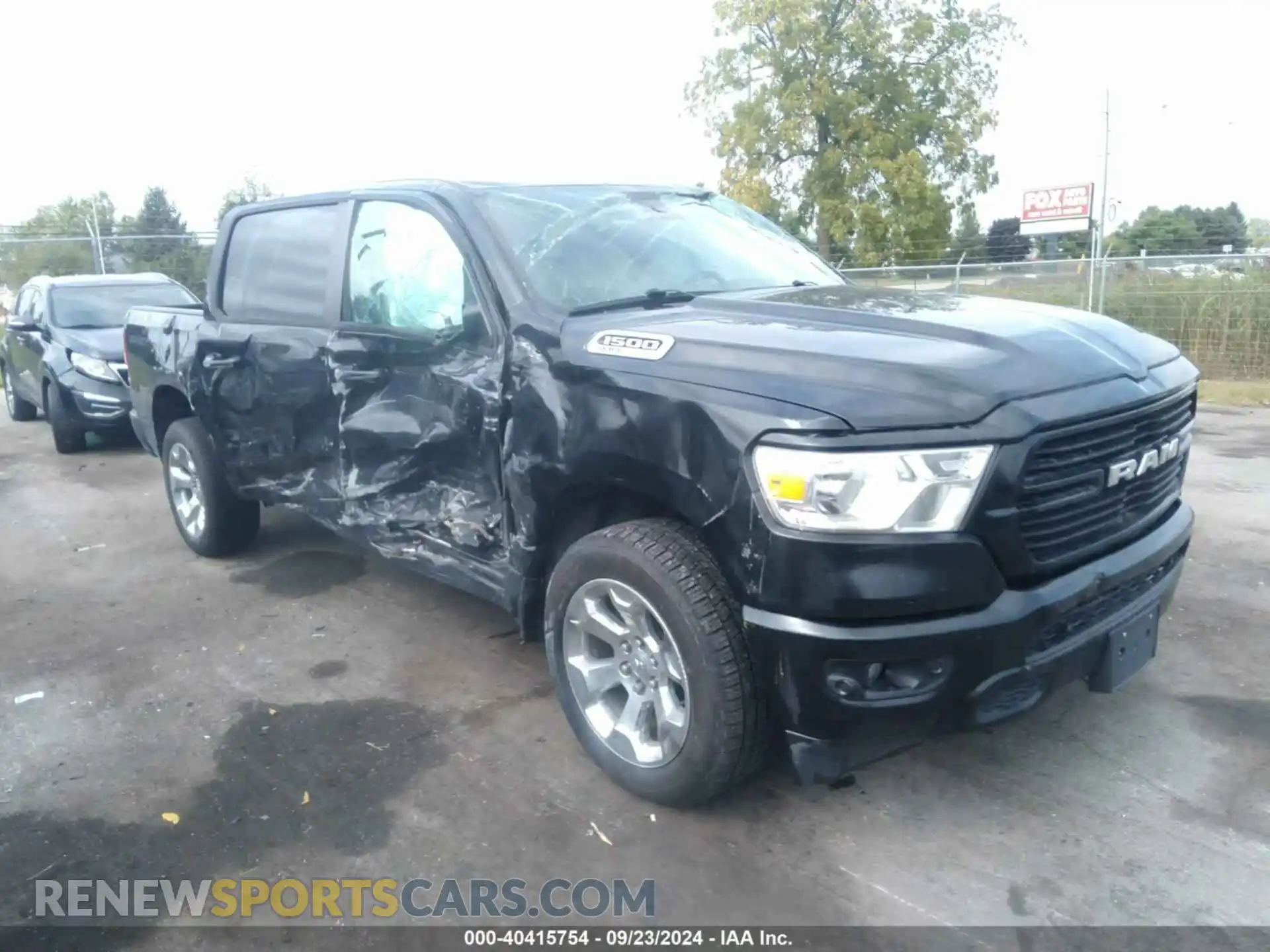 1 Photograph of a damaged car 1C6SRFFT5MN778054 RAM 1500 2021