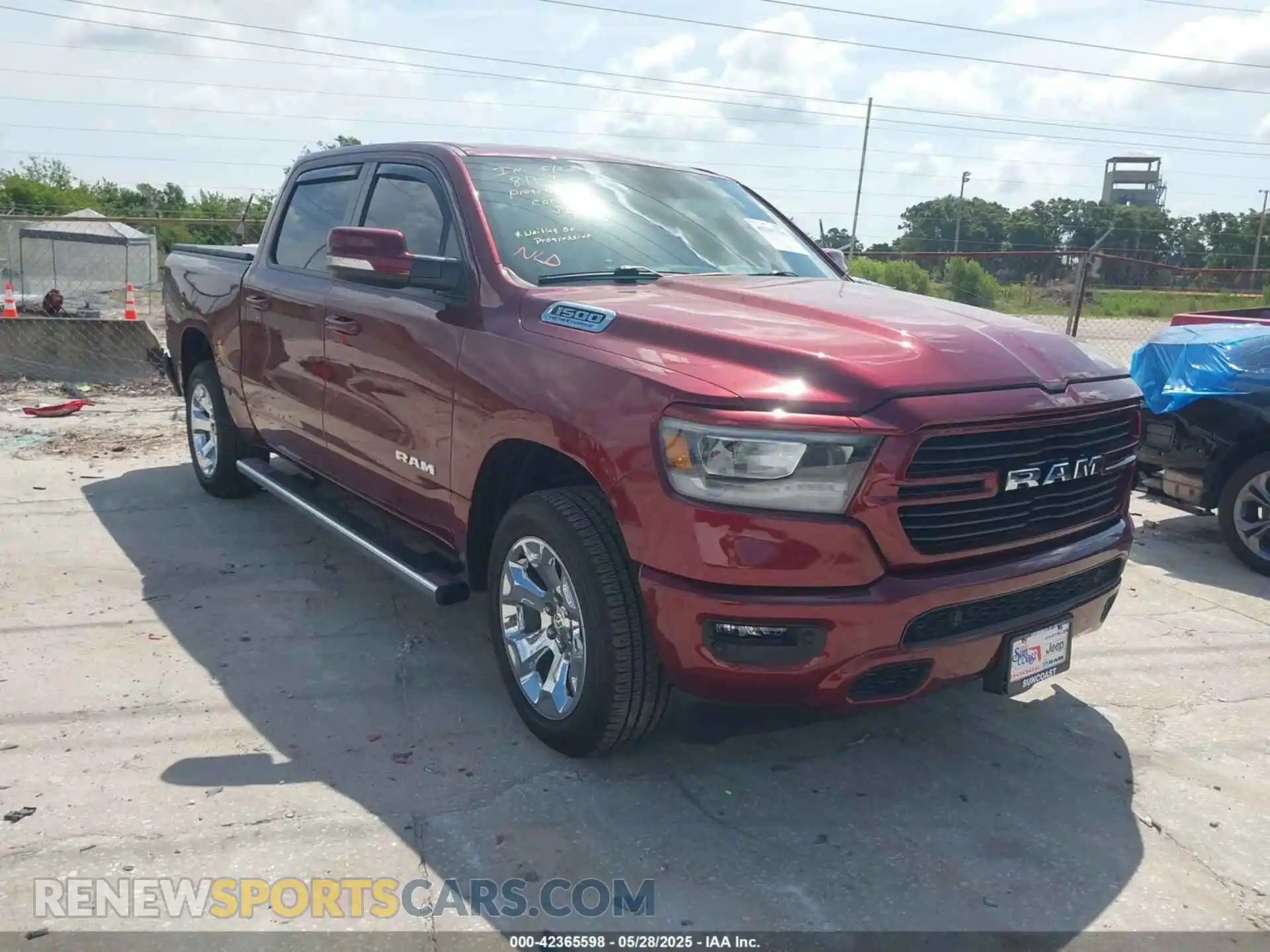 1 Photograph of a damaged car 1C6SRFFT6MN533571 RAM 1500 2021