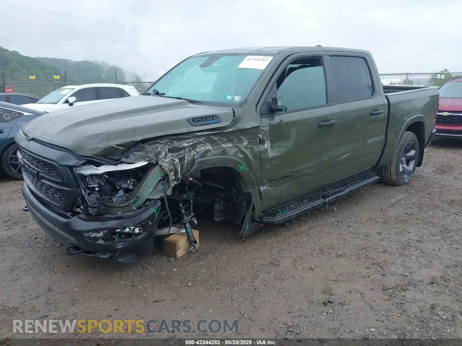2 Photograph of a damaged car 1C6SRFFT6MN695393 RAM 1500 2021