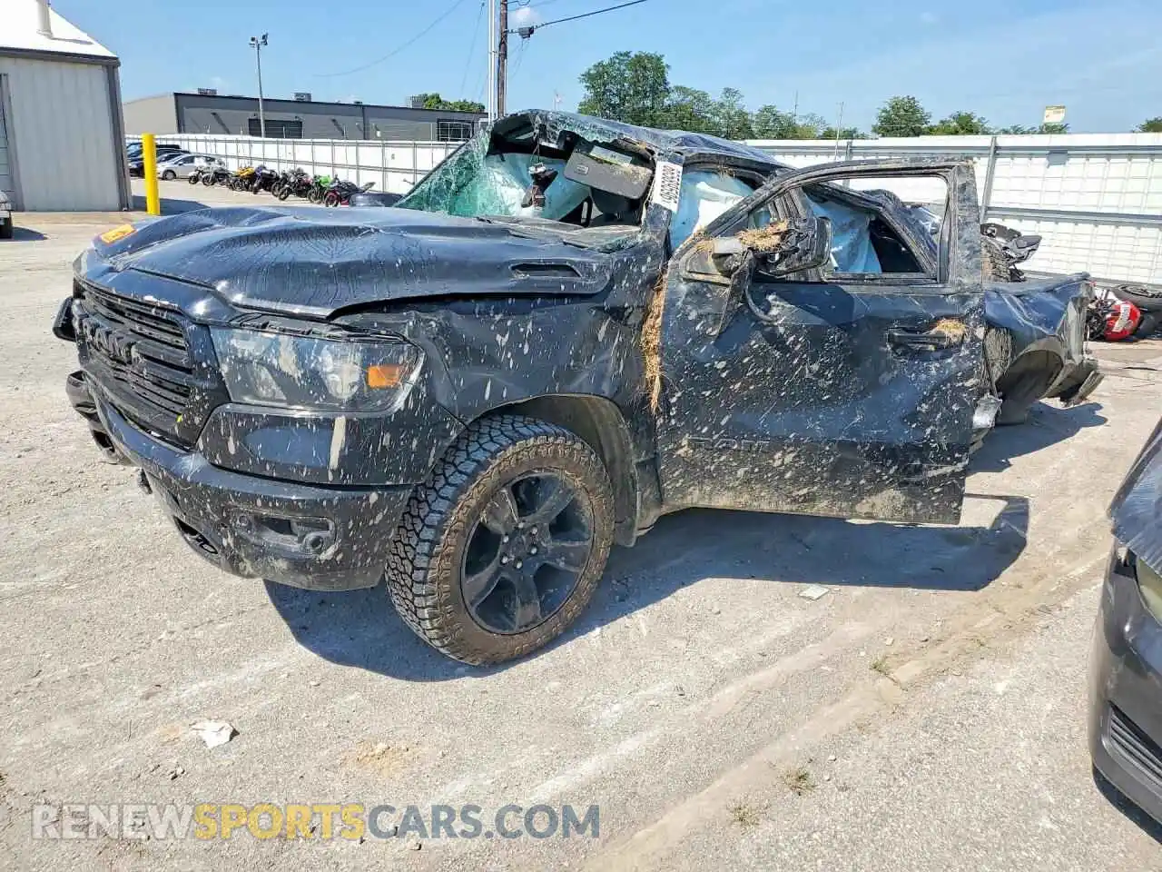 1 Photograph of a damaged car 1C6SRFFT7MN676383 RAM 1500 2021