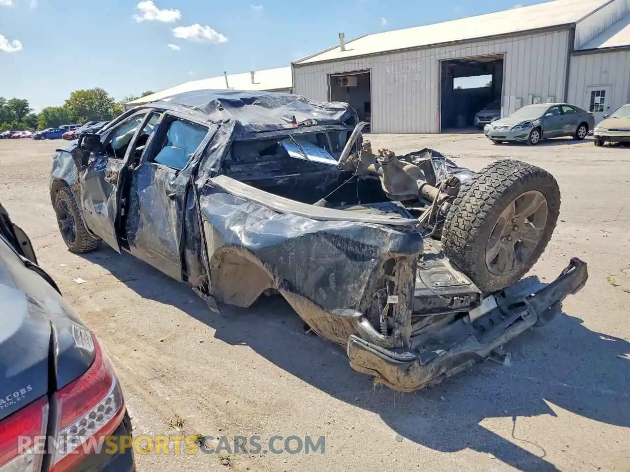 2 Photograph of a damaged car 1C6SRFFT7MN676383 RAM 1500 2021