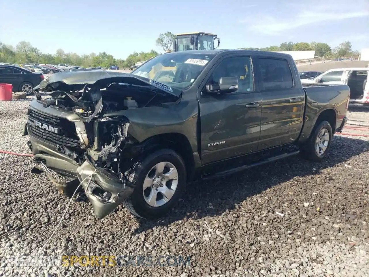 1 Photograph of a damaged car 1C6SRFFT8MN504931 RAM 1500 2021