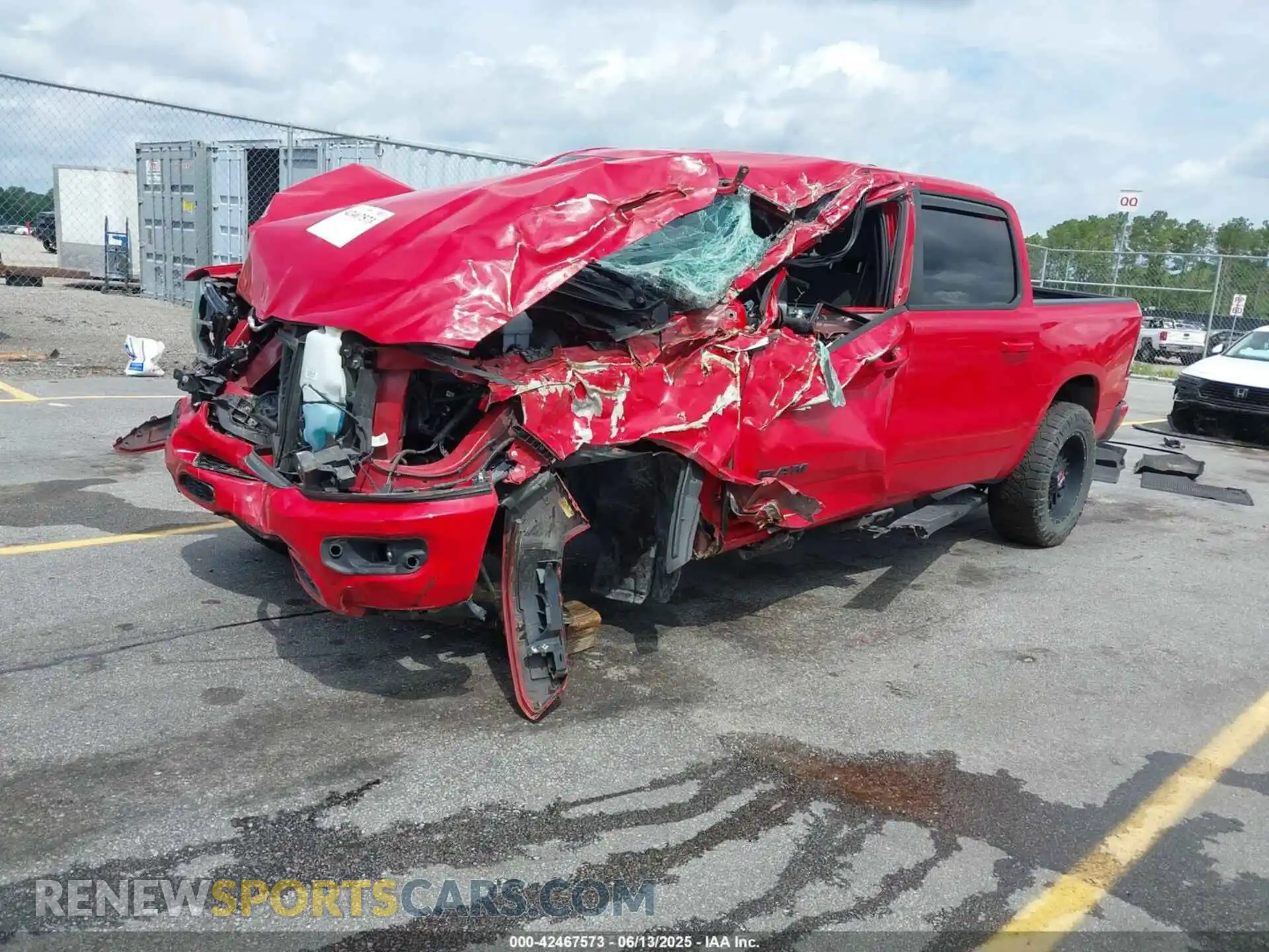 2 Photograph of a damaged car 1C6SRFFT8MN622915 RAM 1500 2021