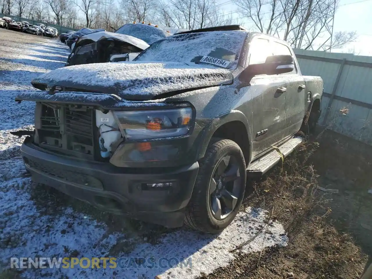 1 Photograph of a damaged car 1C6SRFFT8MN669538 RAM 1500 2021