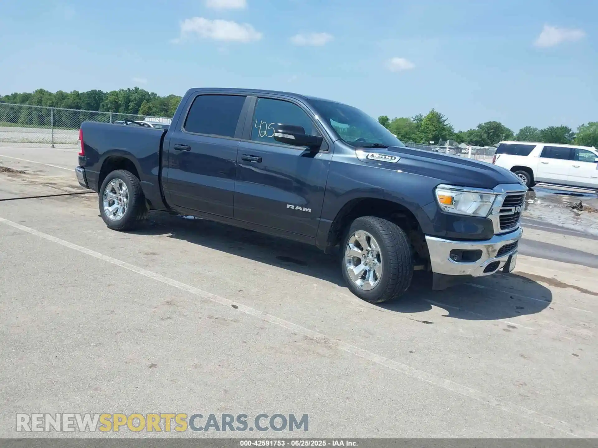 1 Photograph of a damaged car 1C6SRFFTXMN642714 RAM 1500 2021