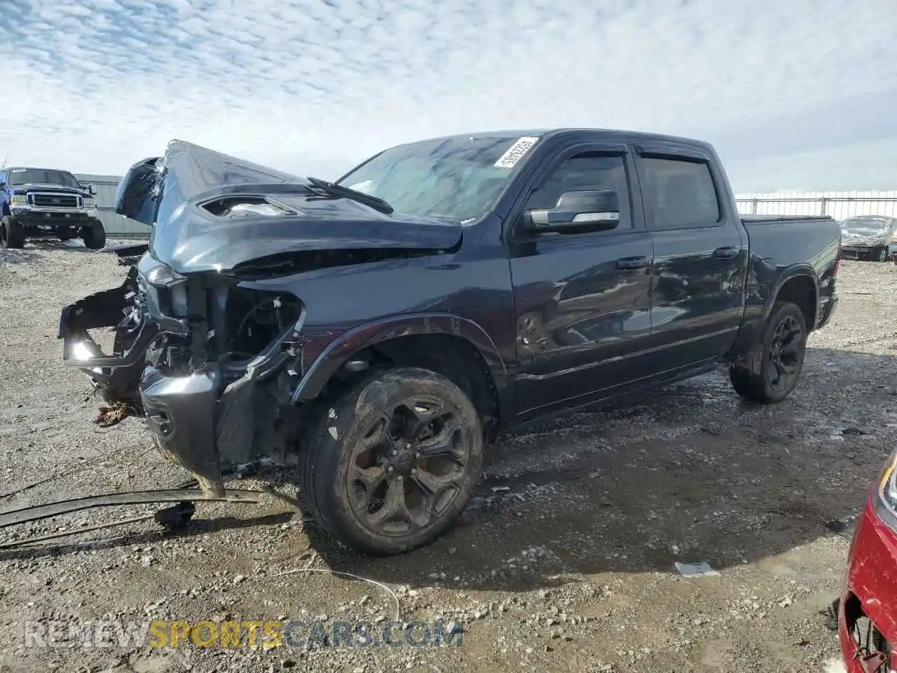 1 Photograph of a damaged car 1C6SRFHMXMN672253 RAM 1500 2021