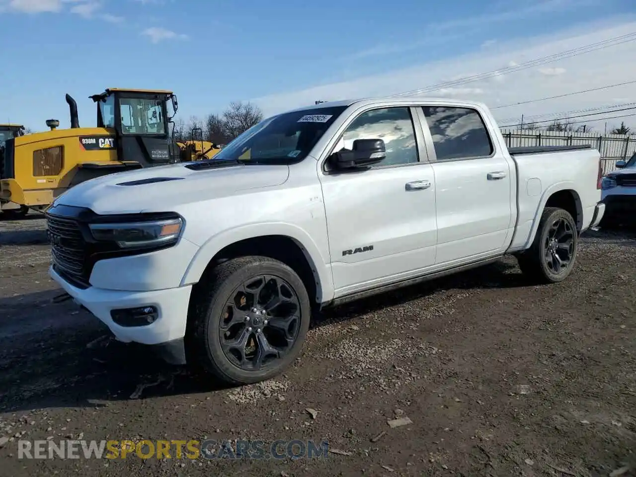 1 Photograph of a damaged car 1C6SRFHT9MN812994 RAM 1500 2021