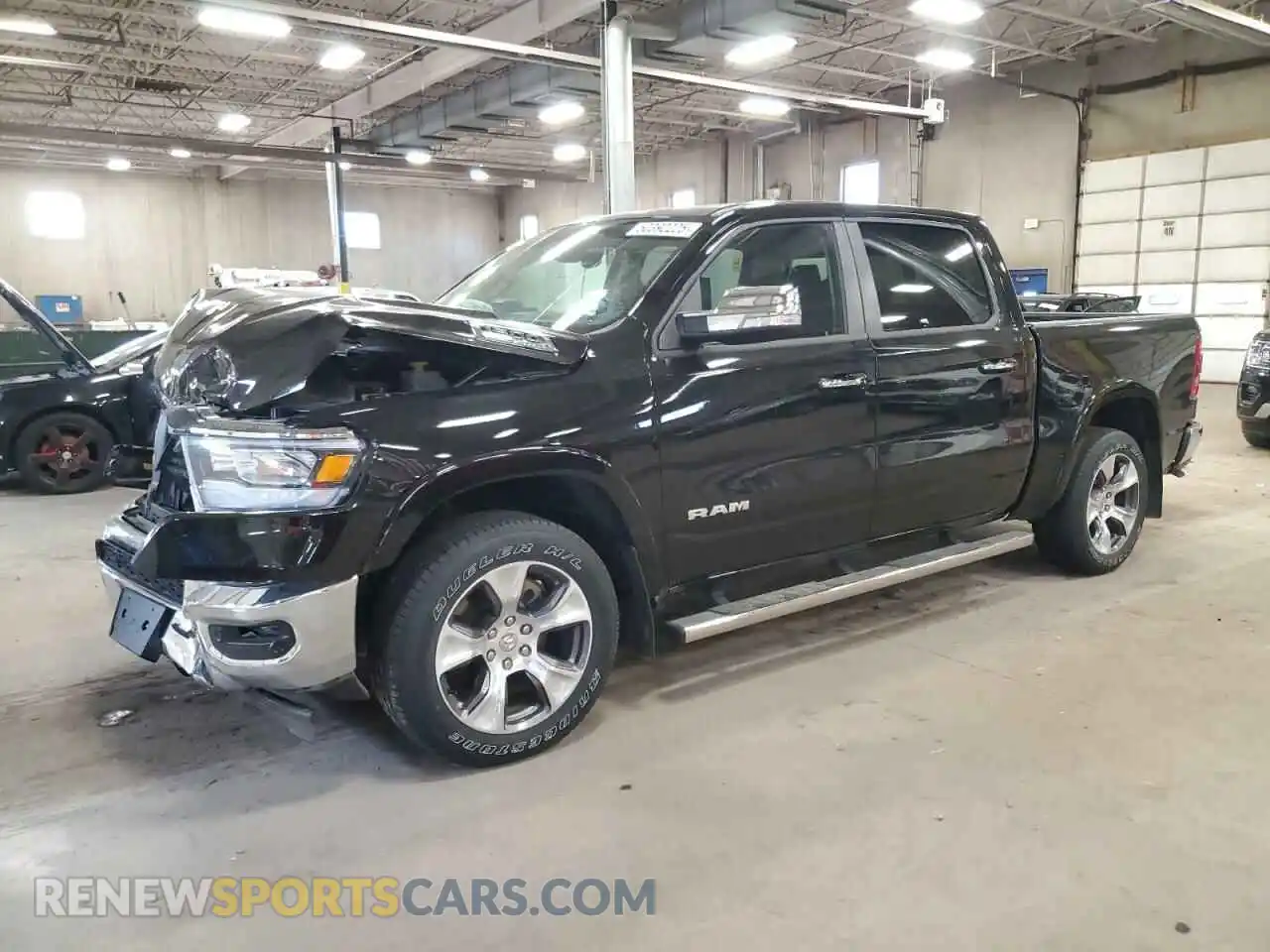 1 Photograph of a damaged car 1C6SRFJT1MN678783 RAM 1500 2021