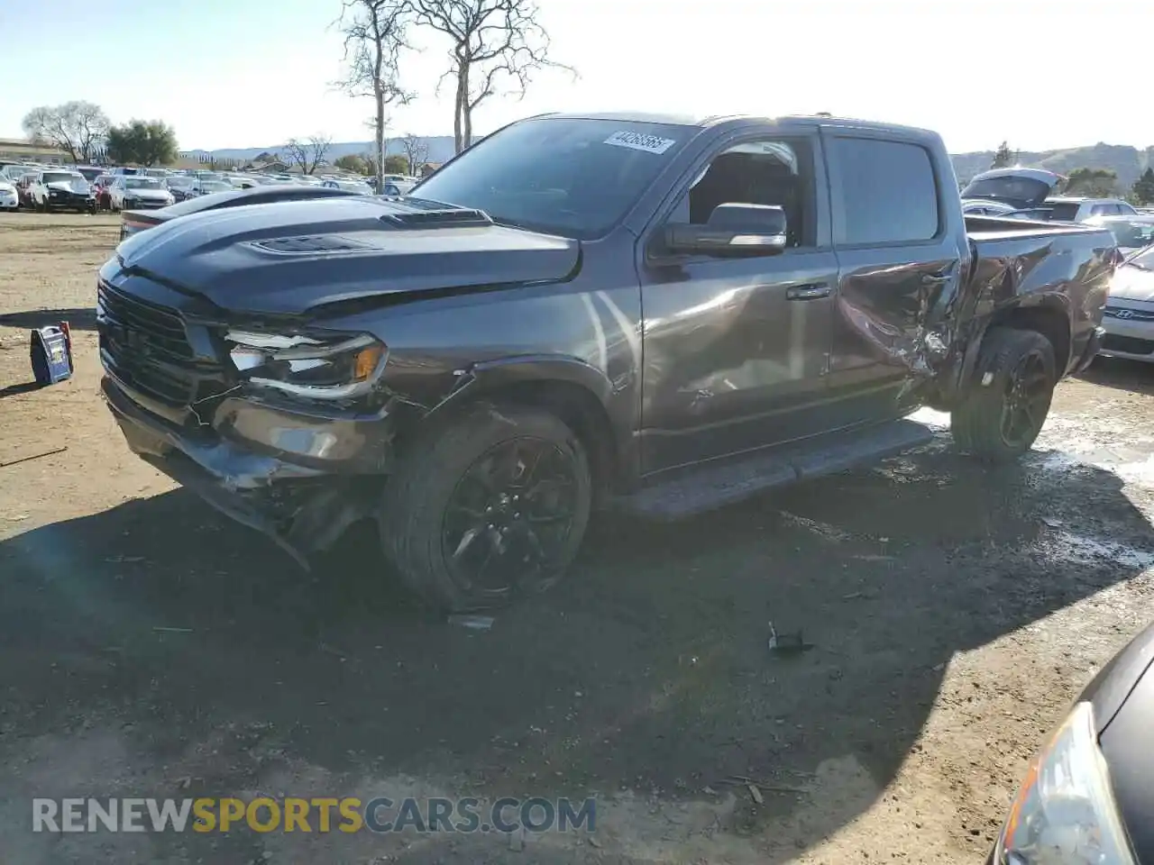1 Photograph of a damaged car 1C6SRFJT8MN739062 RAM 1500 2021
