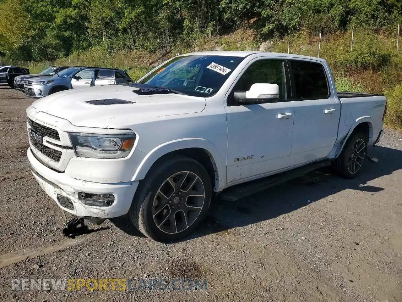 1 Photograph of a damaged car 1C6SRFJT9MN793602 RAM 1500 2021