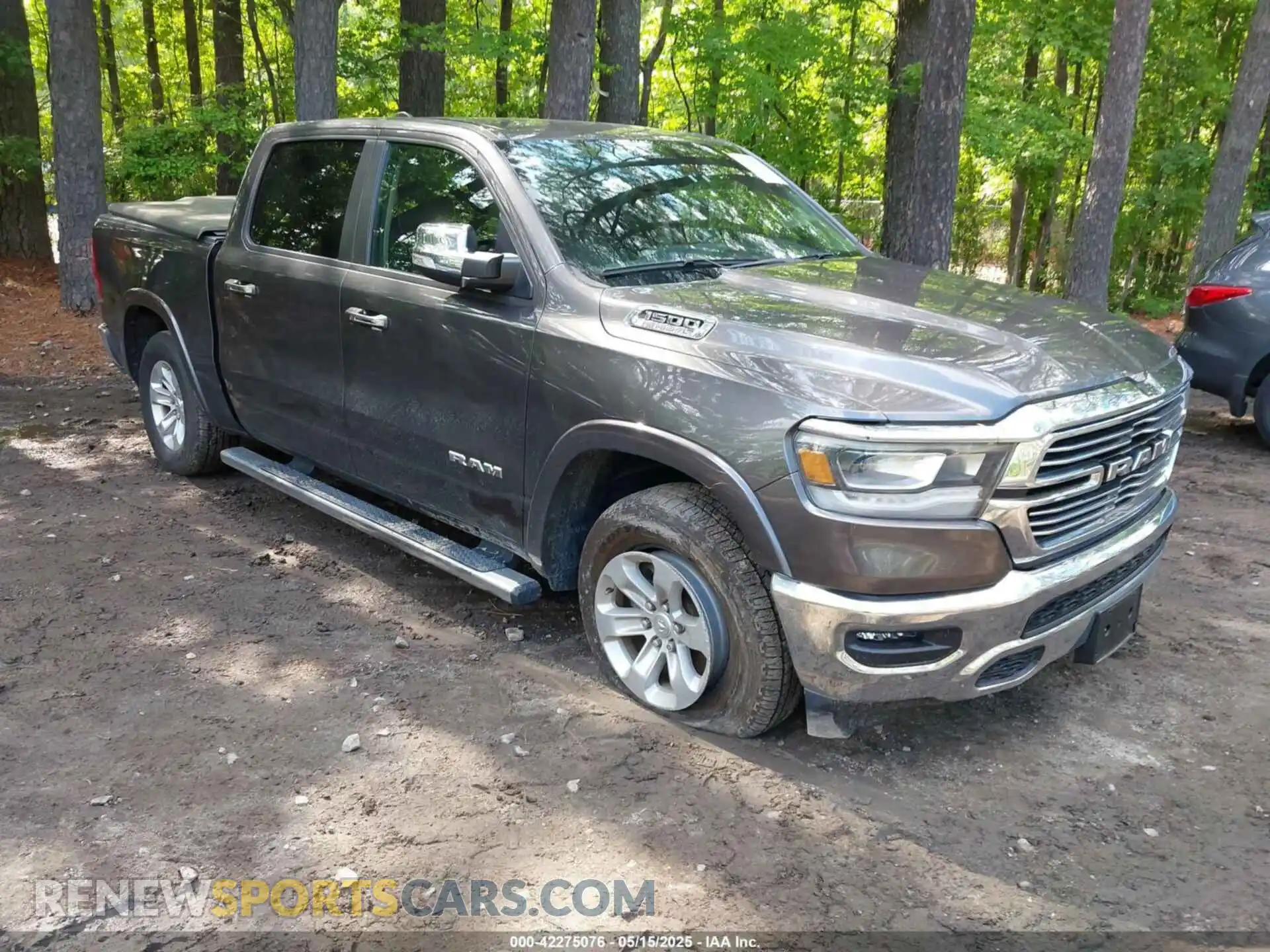 1 Photograph of a damaged car 1C6SRFJTXMN734090 RAM 1500 2021