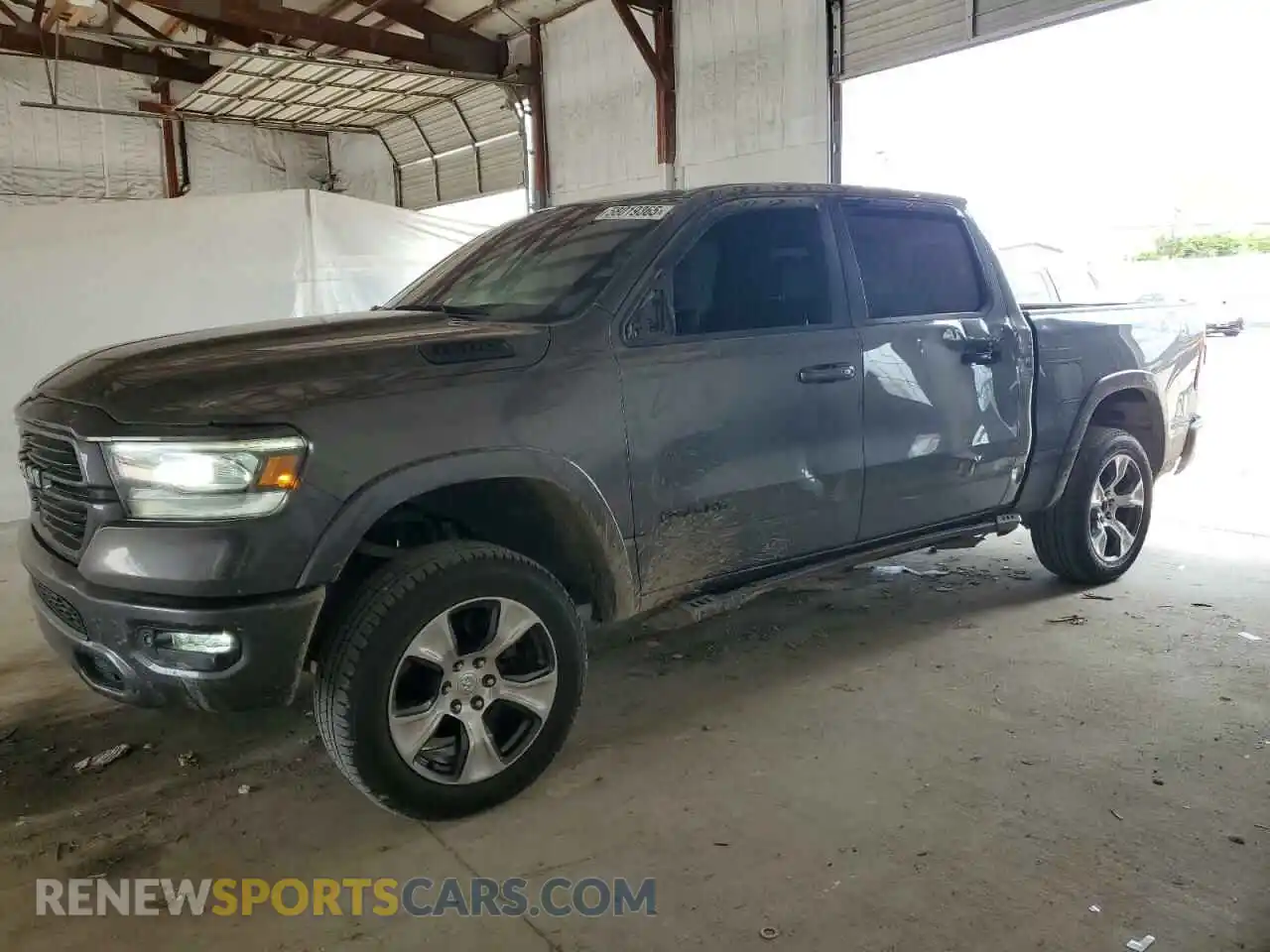 1 Photograph of a damaged car 1C6SRFJTXMN781488 RAM 1500 2021