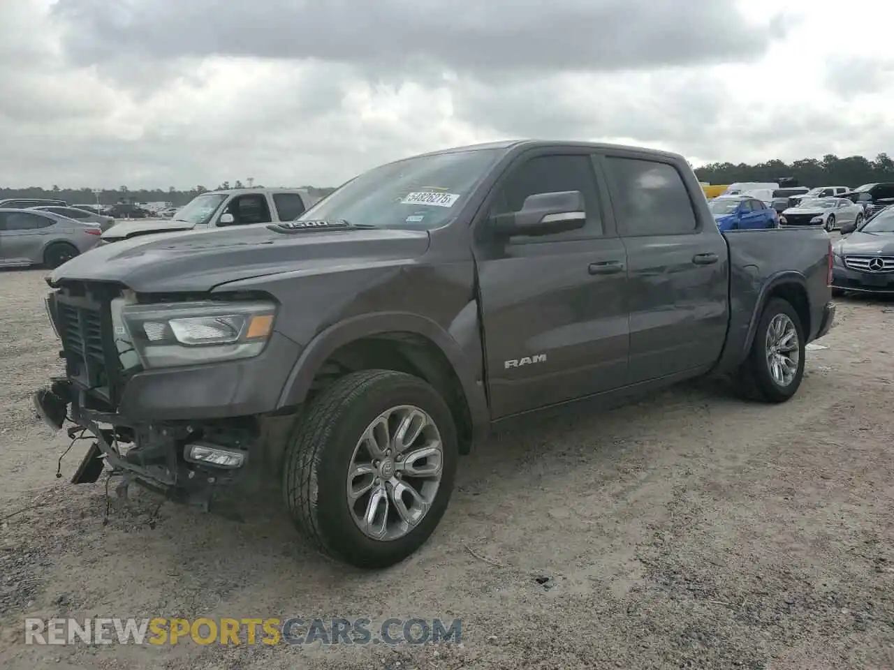 1 Photograph of a damaged car 1C6SRFJTXMN799294 RAM 1500 2021