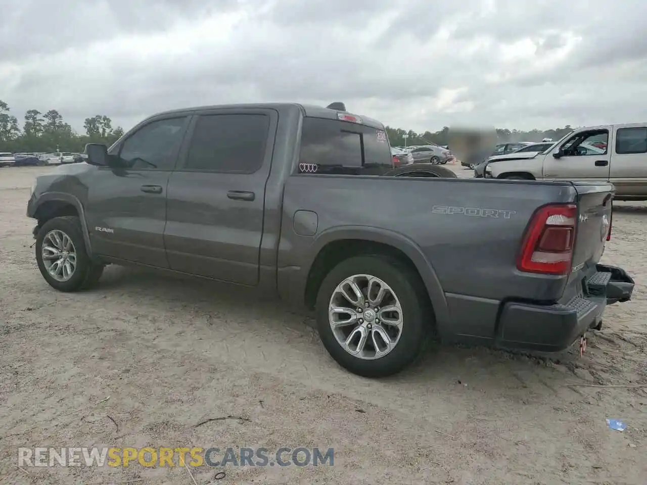2 Photograph of a damaged car 1C6SRFJTXMN799294 RAM 1500 2021
