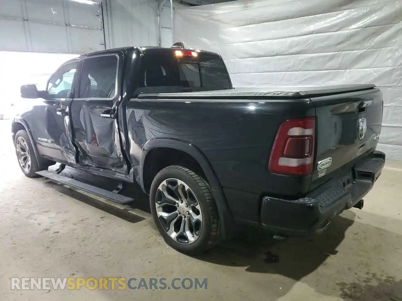 2 Photograph of a damaged car 1C6SRFKT1MN505702 RAM 1500 2021