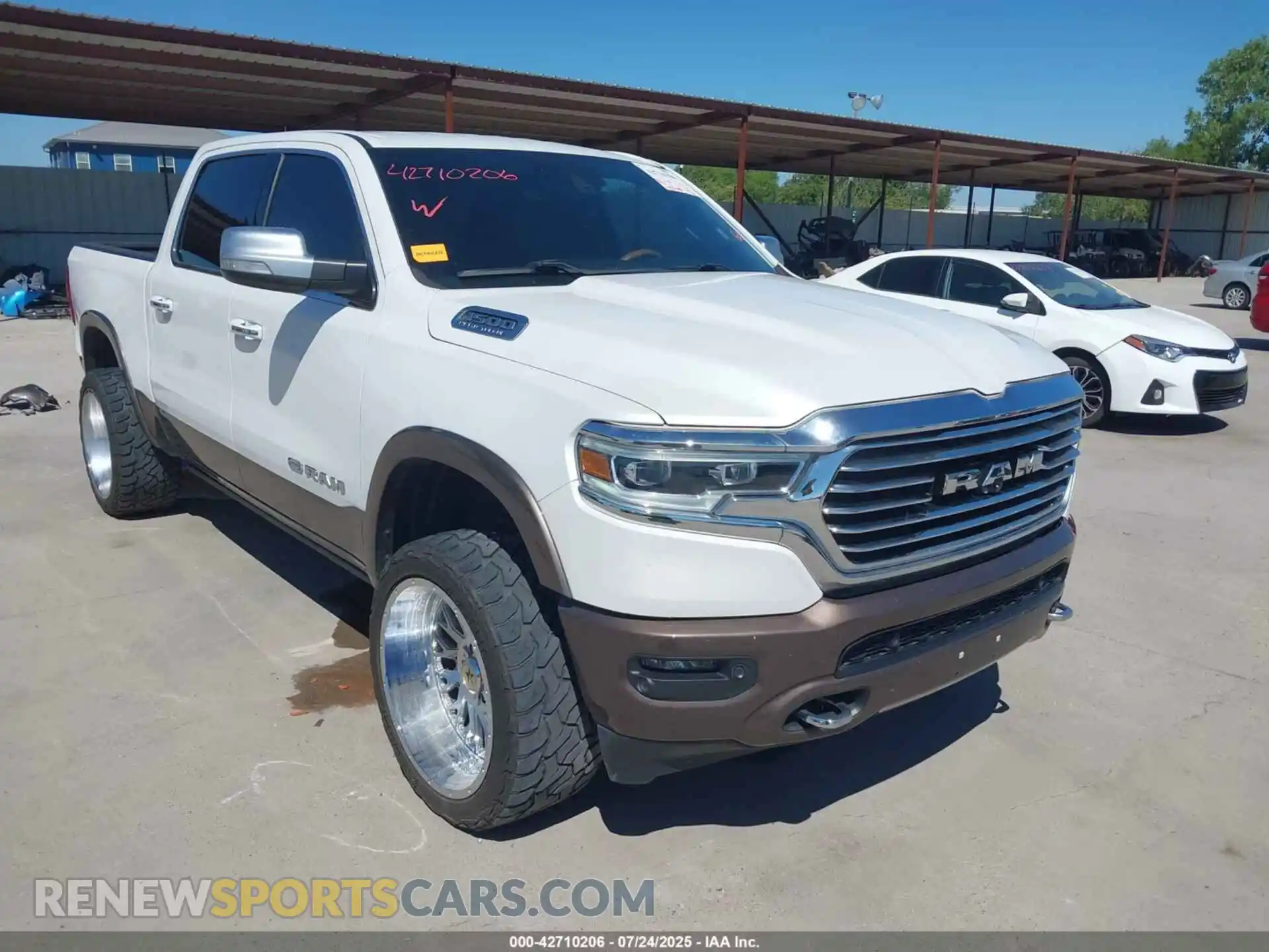 1 Photograph of a damaged car 1C6SRFKT6MN534368 RAM 1500 2021