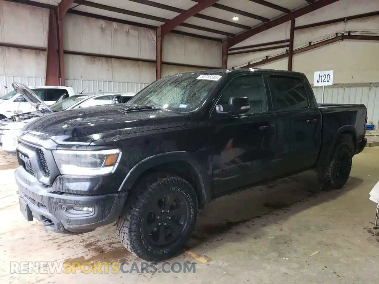 1 Photograph of a damaged car 1C6SRFLM0MN746027 RAM 1500 2021