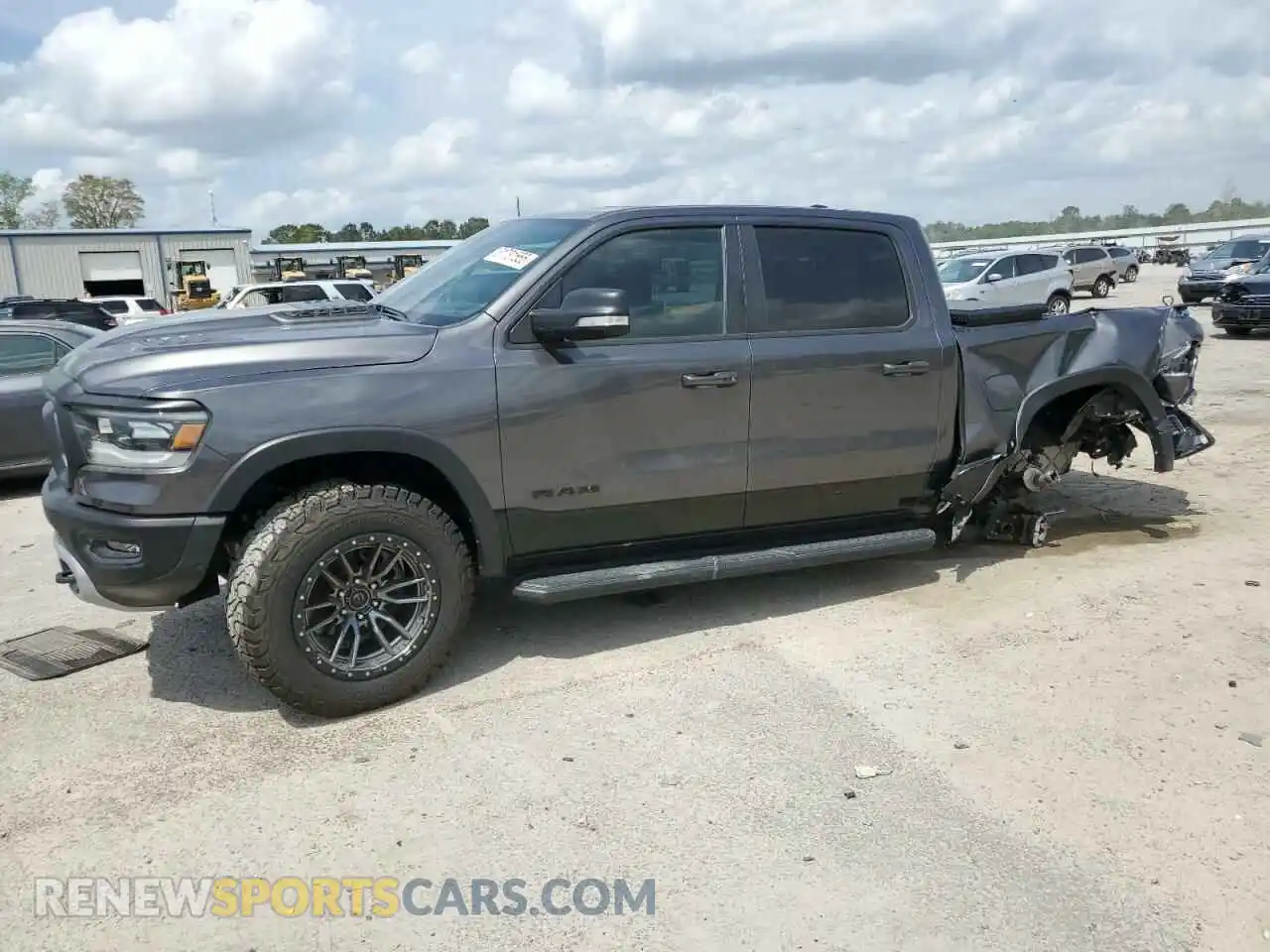 1 Photograph of a damaged car 1C6SRFLT0MN559961 RAM 1500 2021